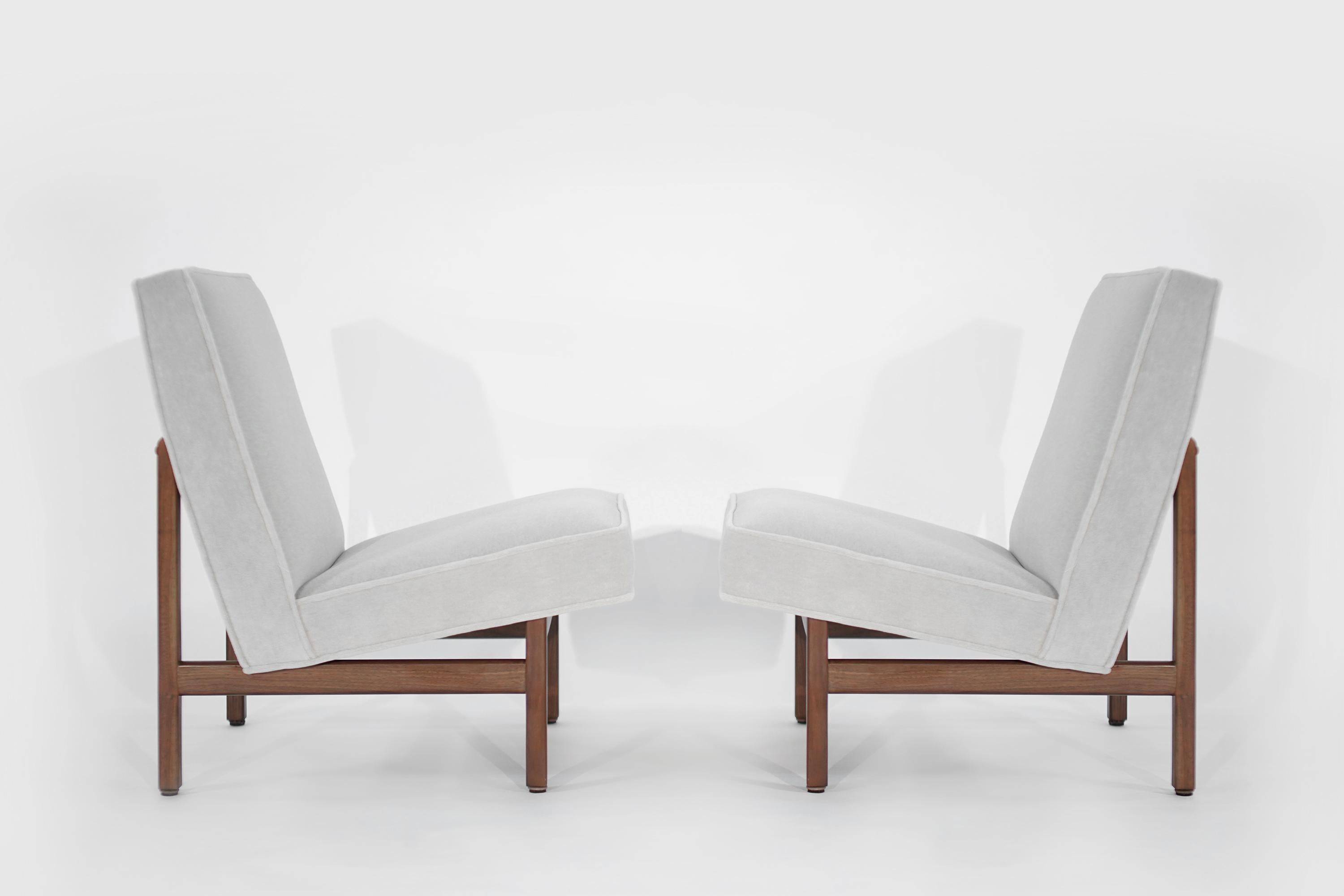 Rarely seen set of slipper chairs designed by Florence Knoll, newly upholstered in Great Plains alpaca velvet by Holly Hunt. Walnut frames fully restored.