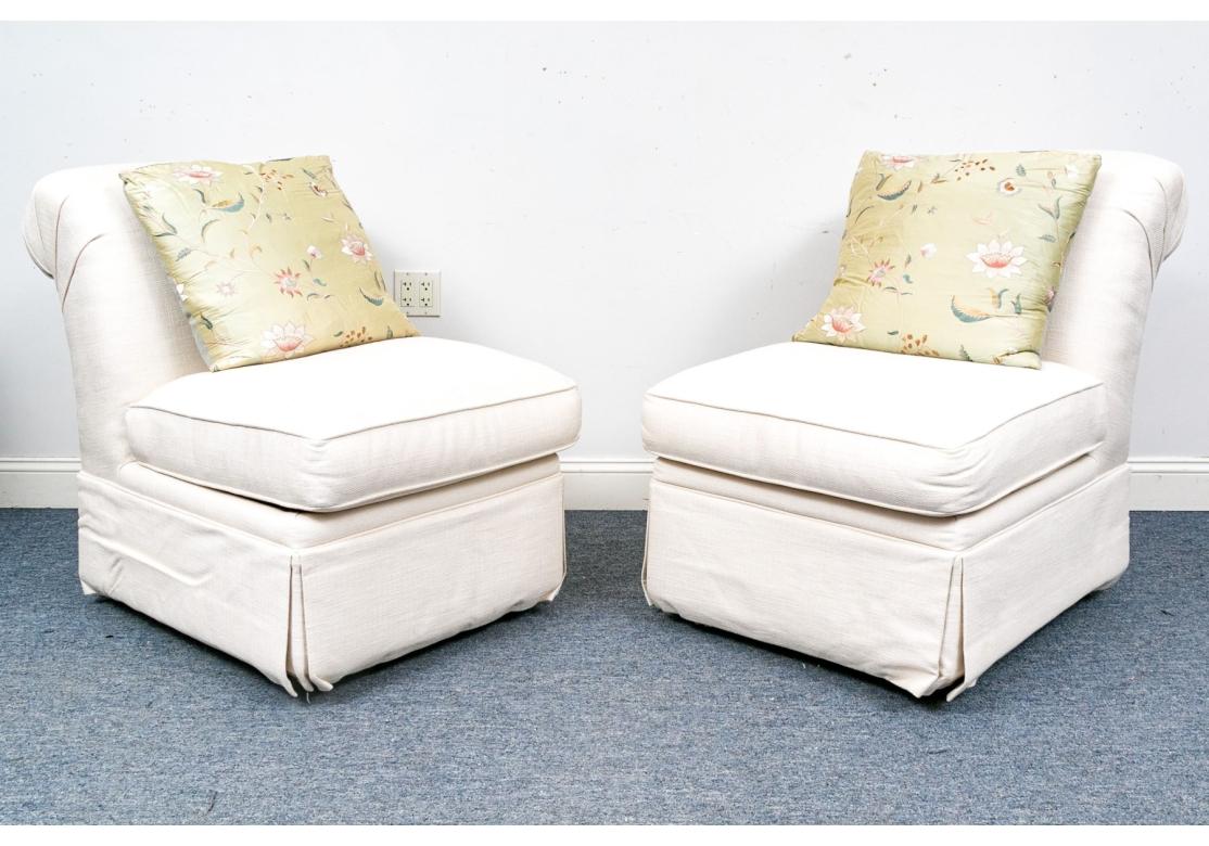 Raised on four short wood legs with skirt to conceal. Each with a loose upholstered seat cushion and rolled back. Together with a down filled floral decorated accent cushion.

Condition: Please see detail photos. Various signs of age include some