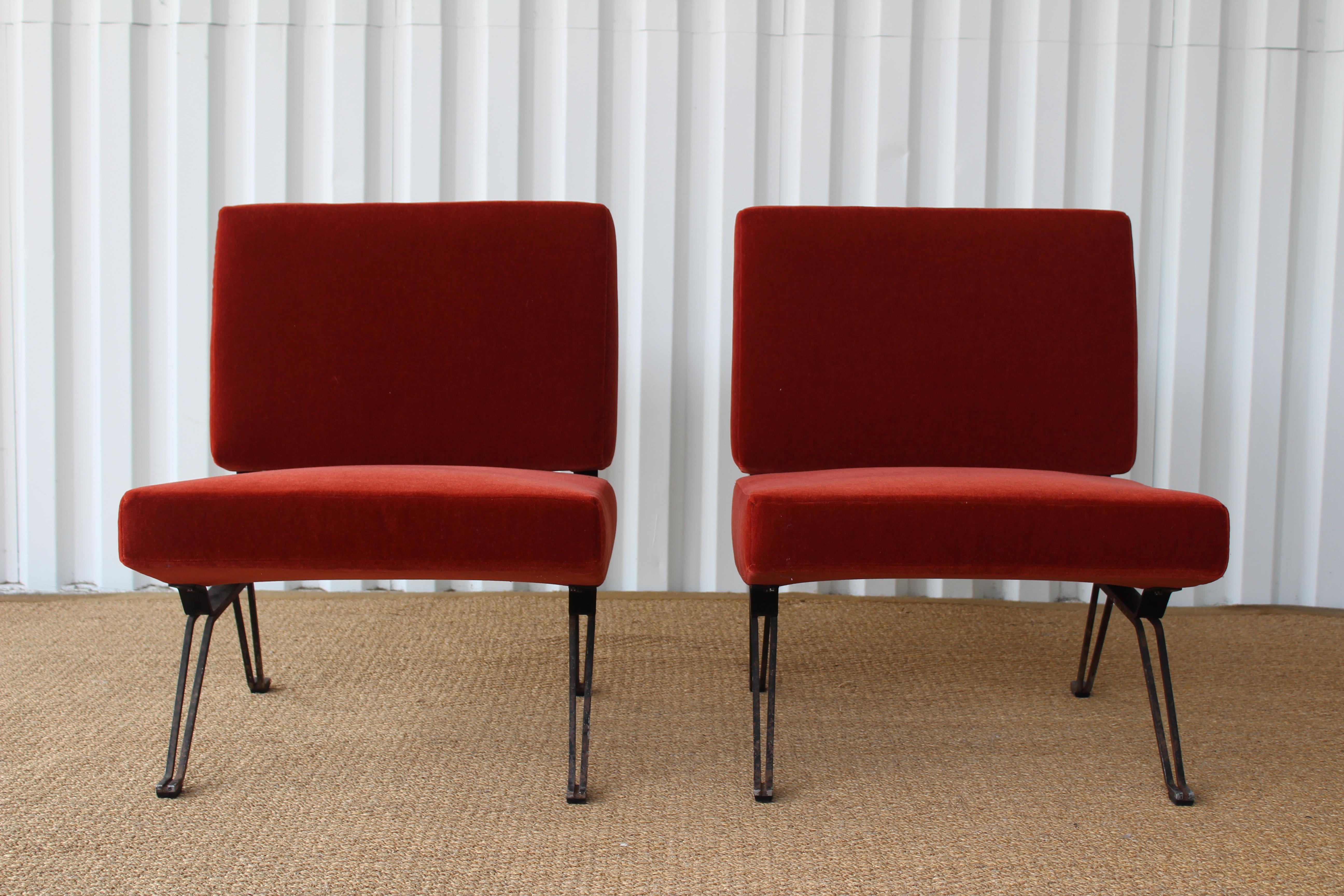 Pair of 1950s Mid-Century Modern chairs from Italy. The pair has been reupholstered in burnt orange mohair. The iron bases have been left with original patina which show signs of wear. Sold only as a pair.