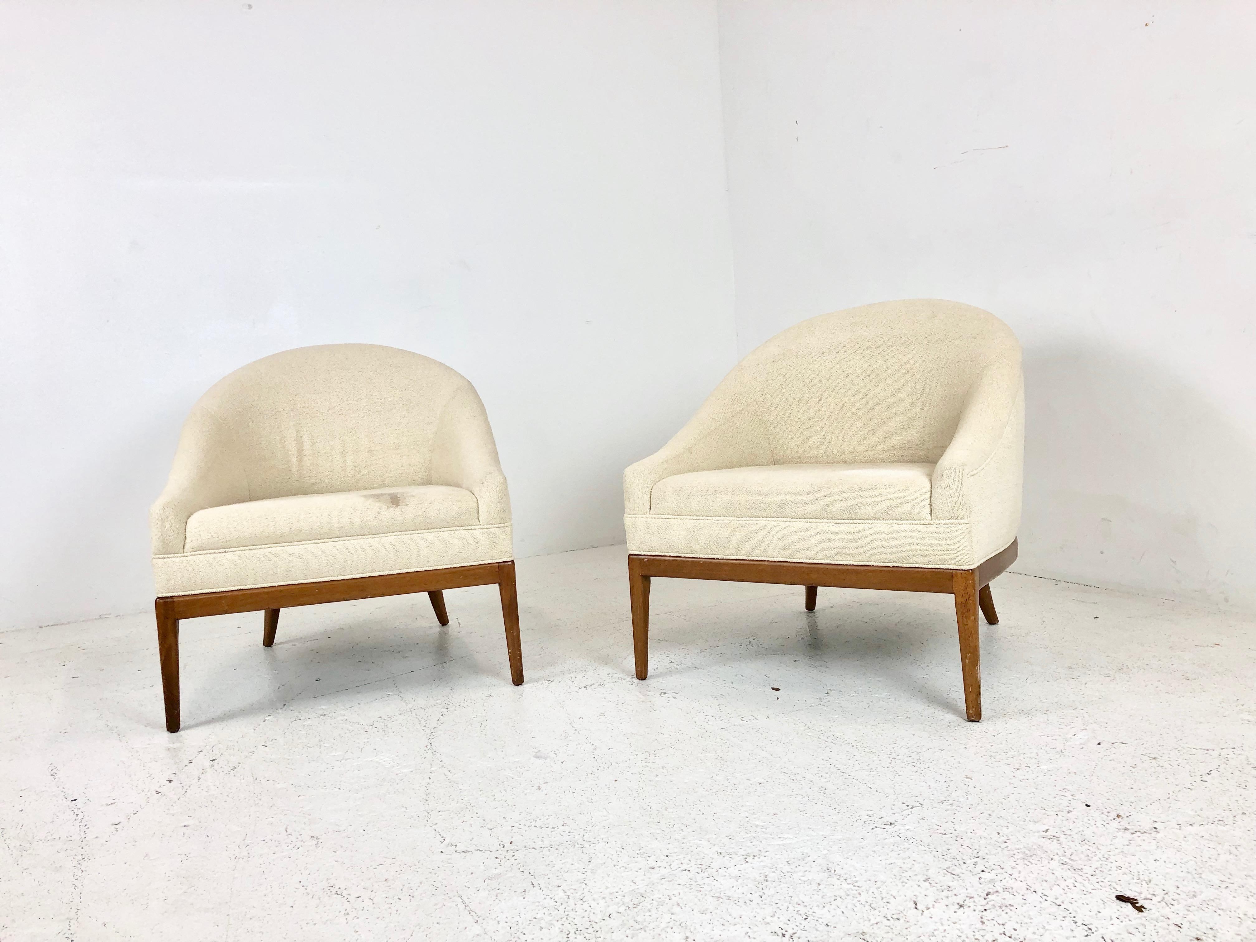 Pair of low seating slipper lounge chairs with wood base in the style of Ward Bennett. Chairs are in good vintage condition. Refinishing and new upholstery is recommended.

Dimensions: 24 W x 28 D x 28 T
seat height 16.
 