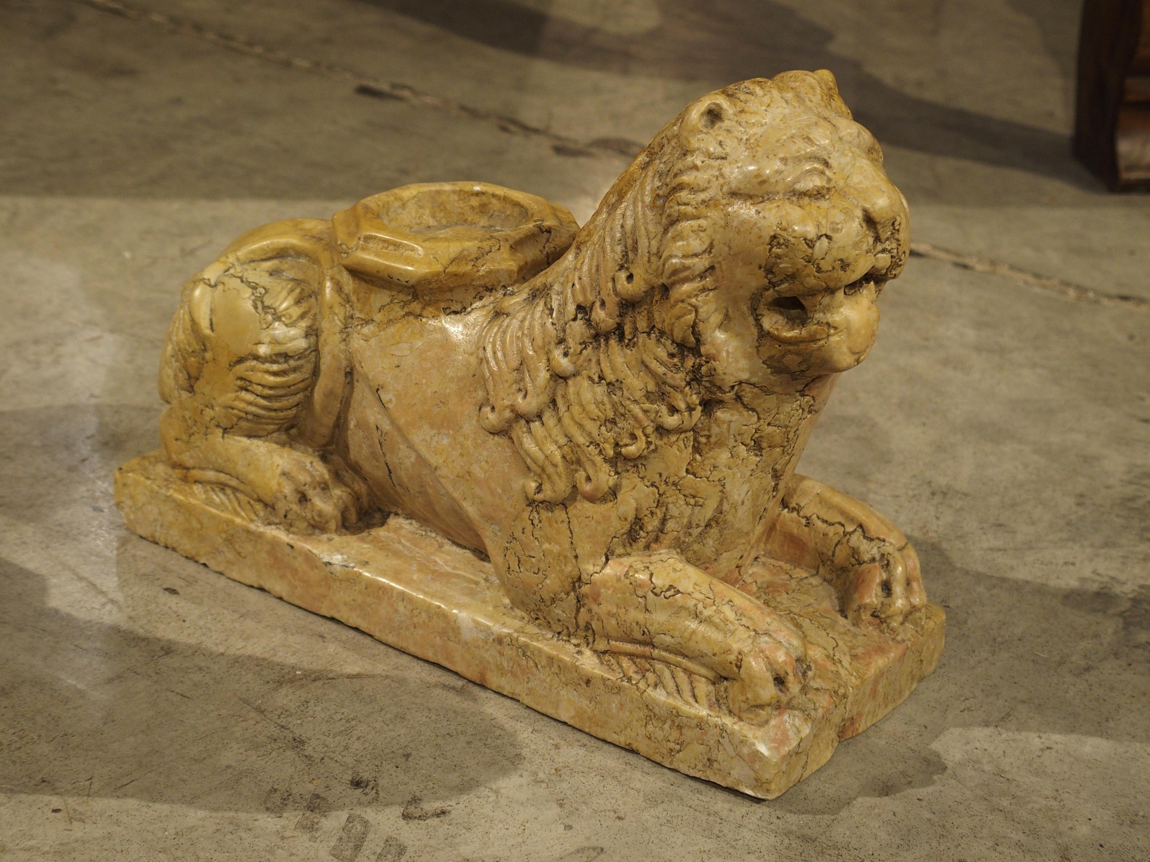 These wonderful Giallo Reale marble lion column supports are smaller carved versions after those that were done in the 16th century. On the upper middle back of each of the lions is a hexagonal support for the columns. Today these marble lions could