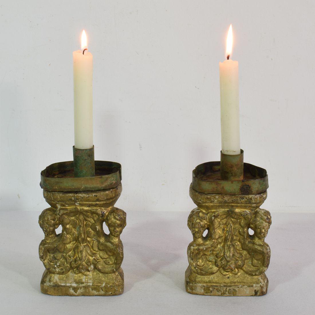 Wondeful small Baroque giltwood candleholders with angels, Italy, circa 1650-1750. Weathered, repairs and small losses. Actual copper candleholders on top are of later date.
Measurement individual.