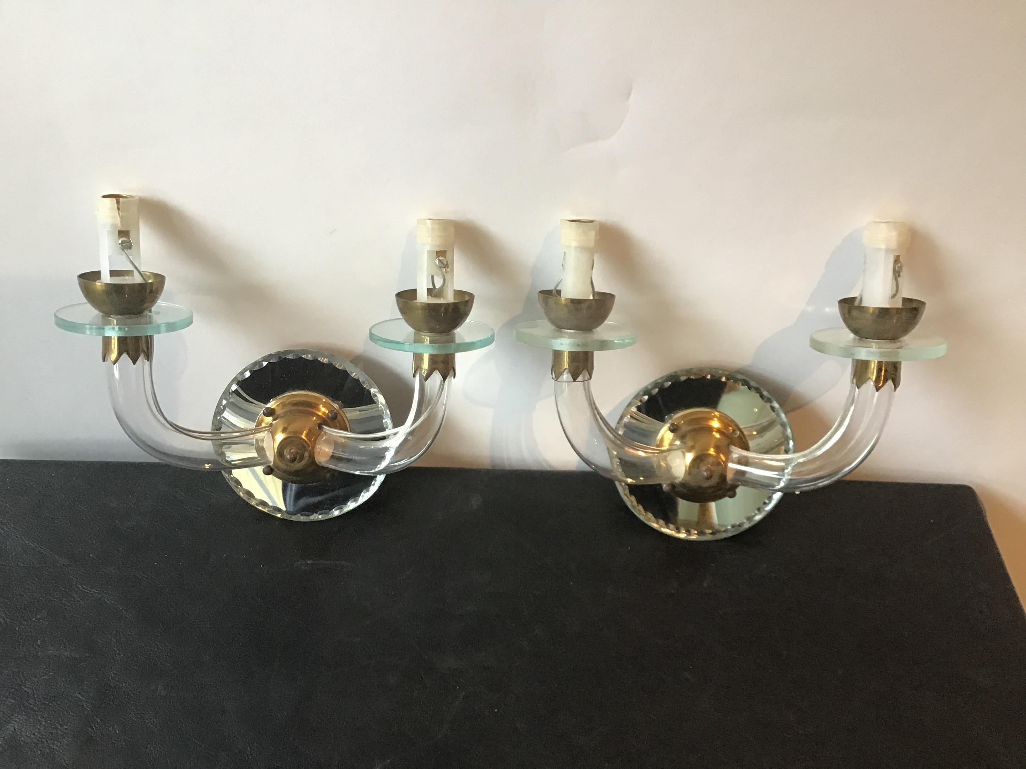 Pair of small 1940s French mirrored back sconces with glass arms. Purchased from a Greenwich, Connecticut mansion.