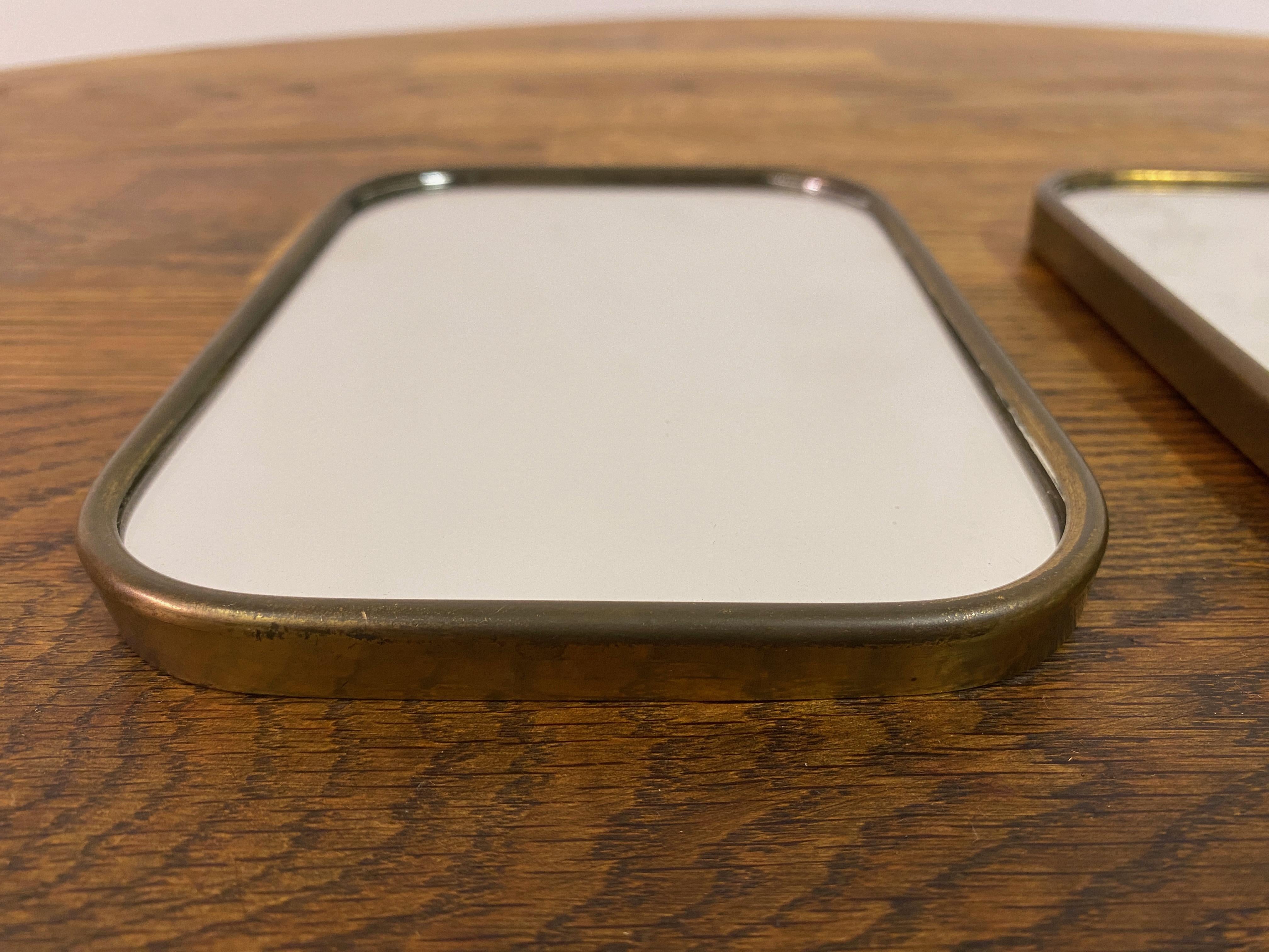Mid-Century Modern Pair Of Small 1950S Italian Brass Framed Mirrors For Sale