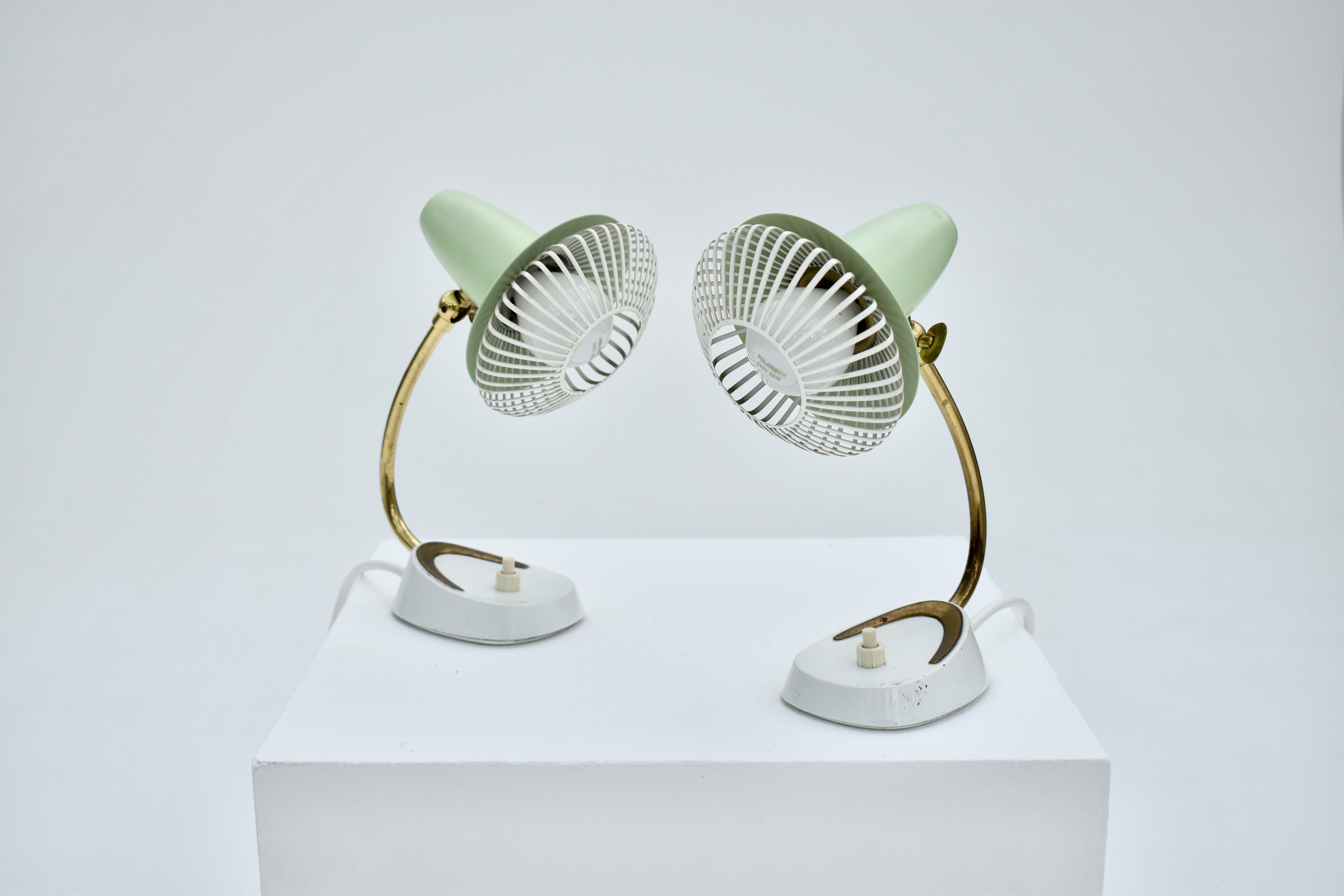 A very sweet pair of table lamps produced by Cosack Leuchten, Germany.

Unusual metal grill shades which give a lovely effect when lit. The original light green colour is particularly beautiful.

Each lamp has been re-wired.

A rare model,