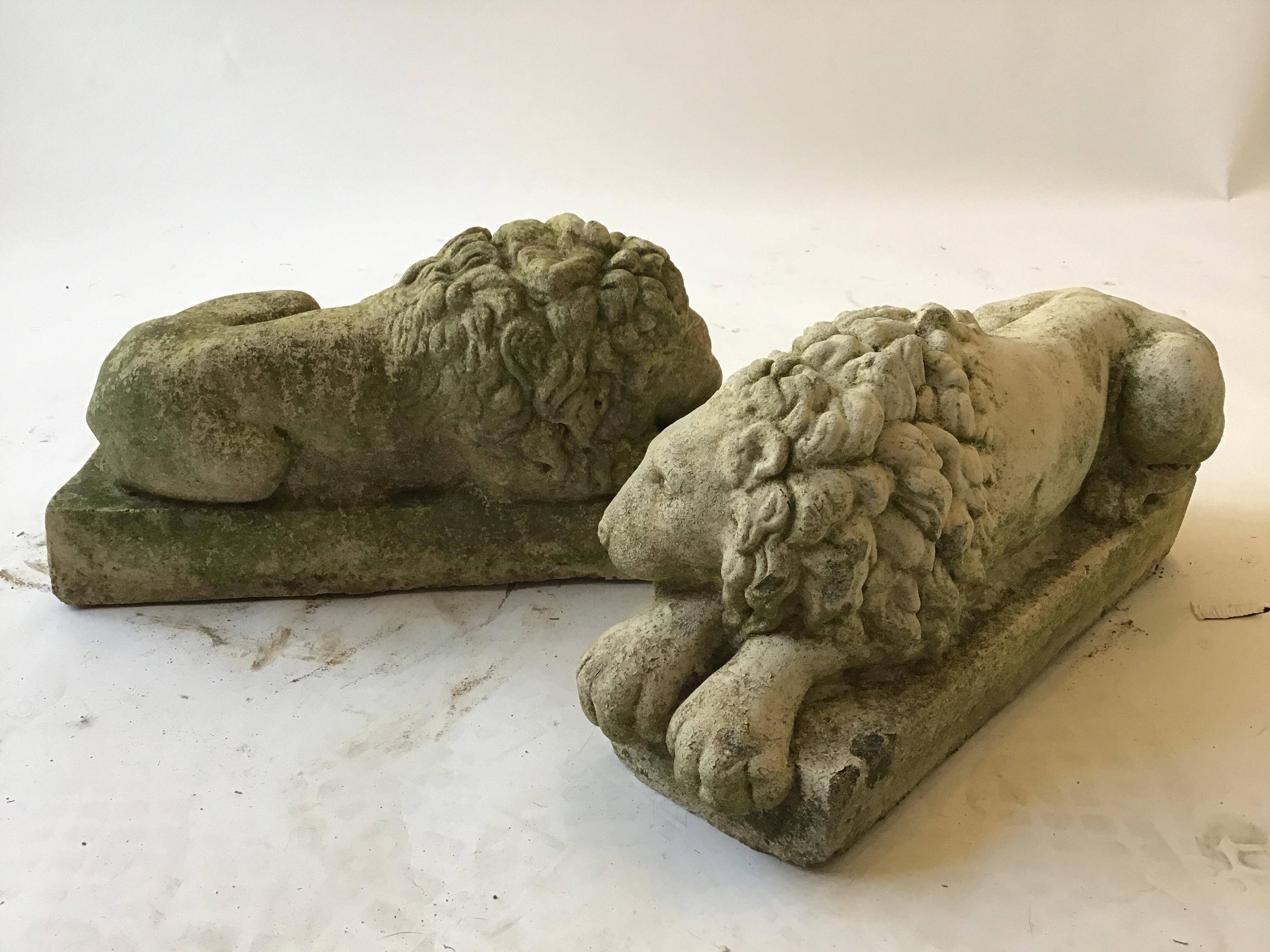 Pair of small 1960s concrete lions. Though these are a pair, both lions are in different positions.