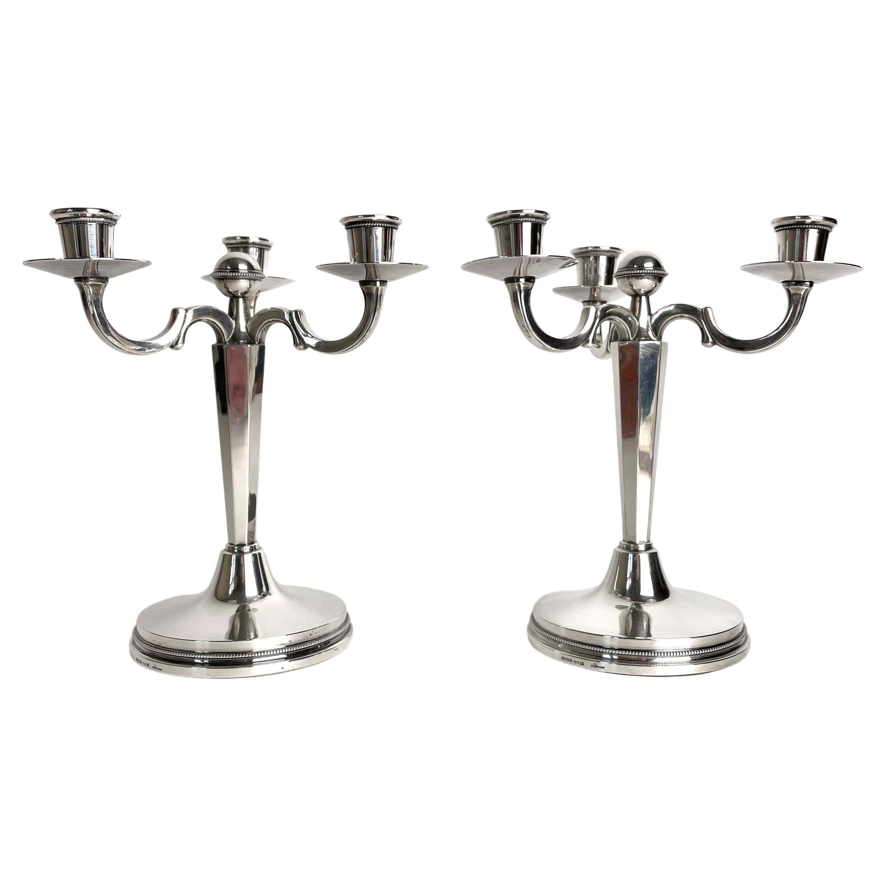 Pair of small and elegant candelabras in Silver by Eric Löfman, Sweden in 1972 For Sale