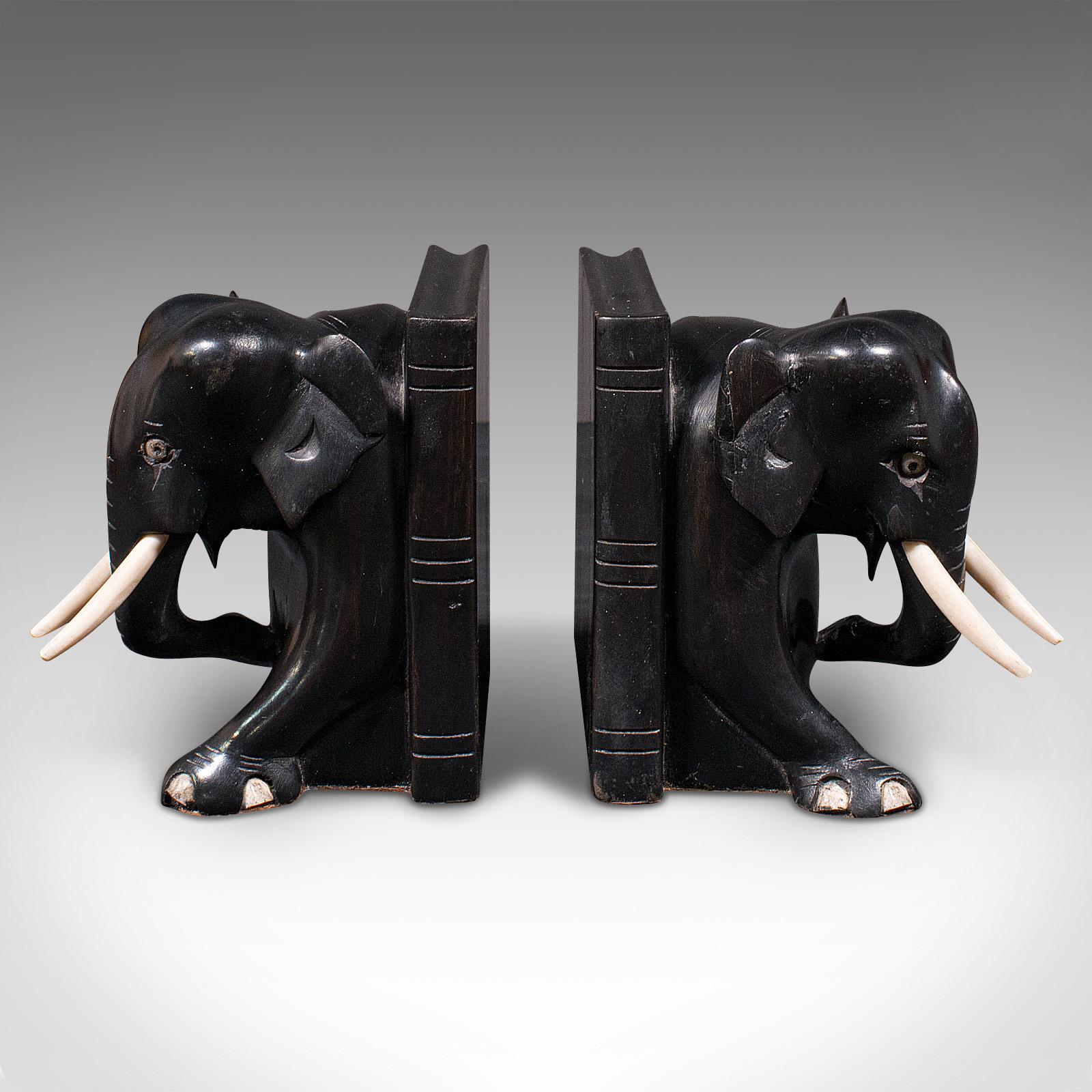 This is a pair of small antique elephant bookends. An Indian, ebony and bone carved animal novel or book rest, dating to the late Victorian period, circa 1880.

Wonderful character and decorative appeal for the reader
Displaying a desirable aged