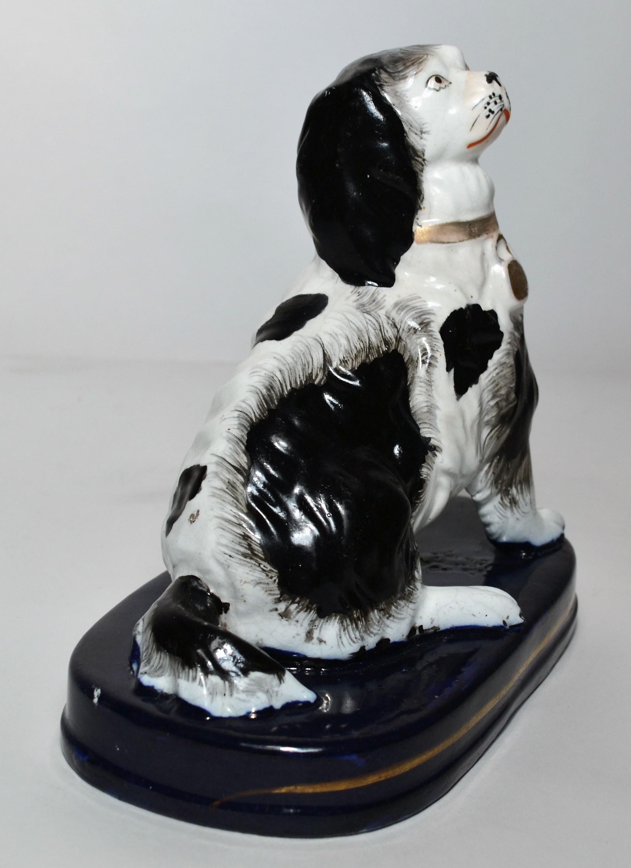 This pair of small black and white Staffordshire is very sweet.