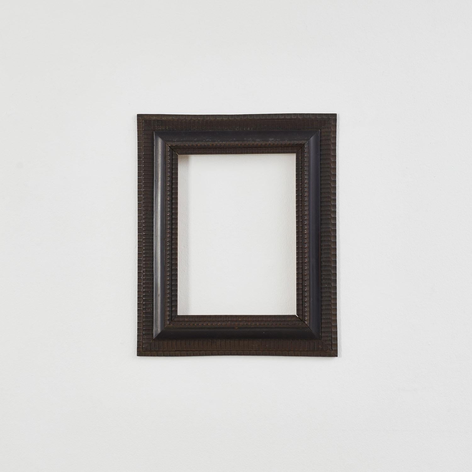 An Antique ripple frames in ebonised wood. The distinctive undulating pattern is thought to have its roots in German and Dutch craftsmanship from the 17th century.