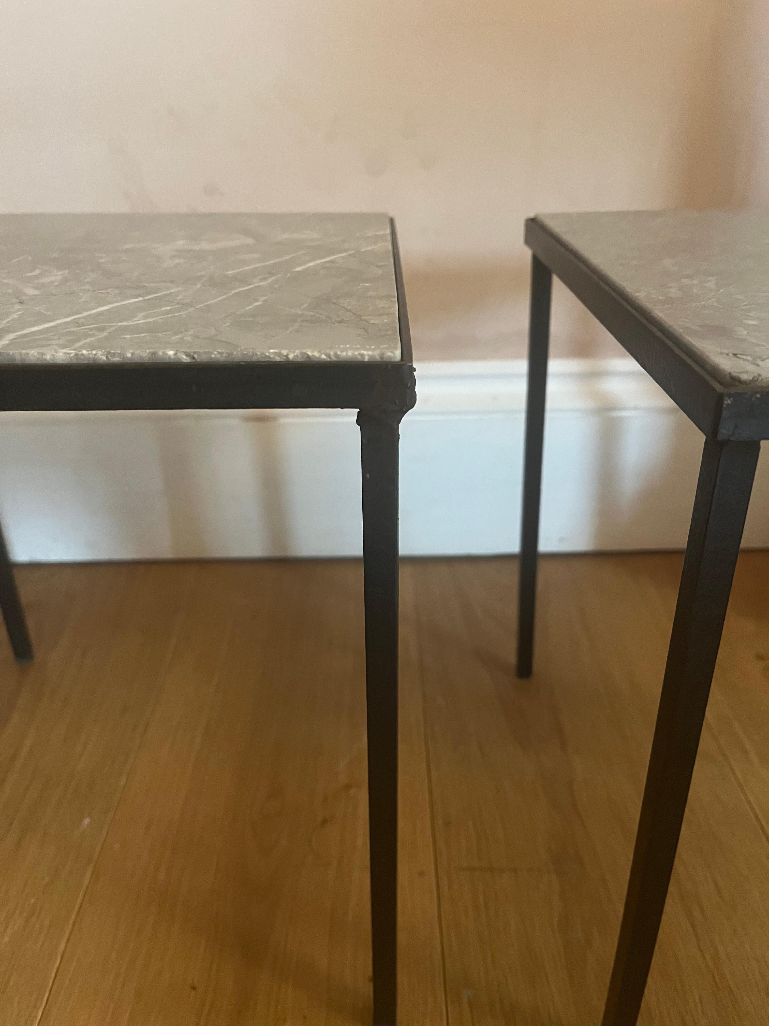 Pair of small black metal and stone side tables. 5