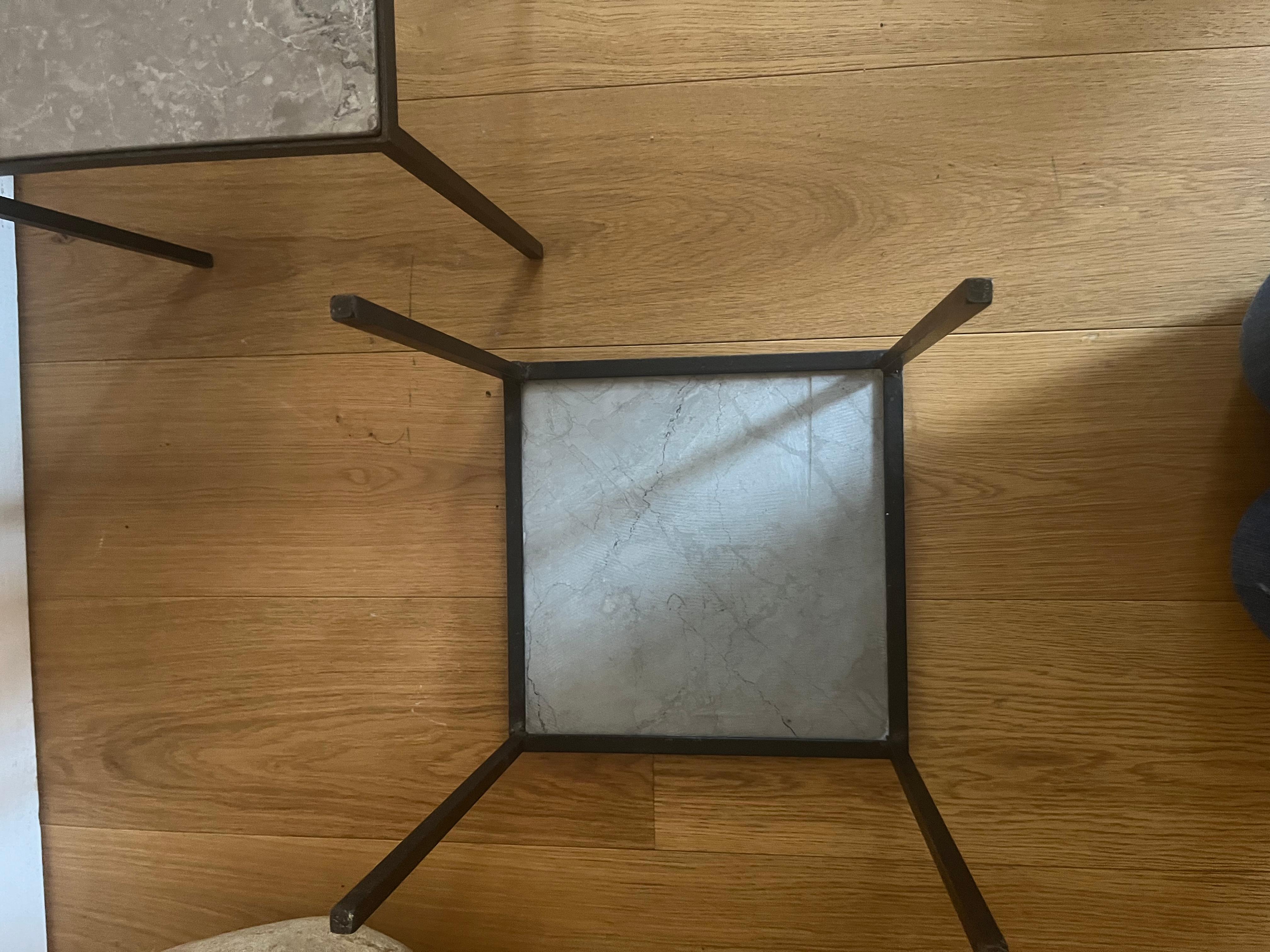 Pair of small black metal and stone side tables. 2