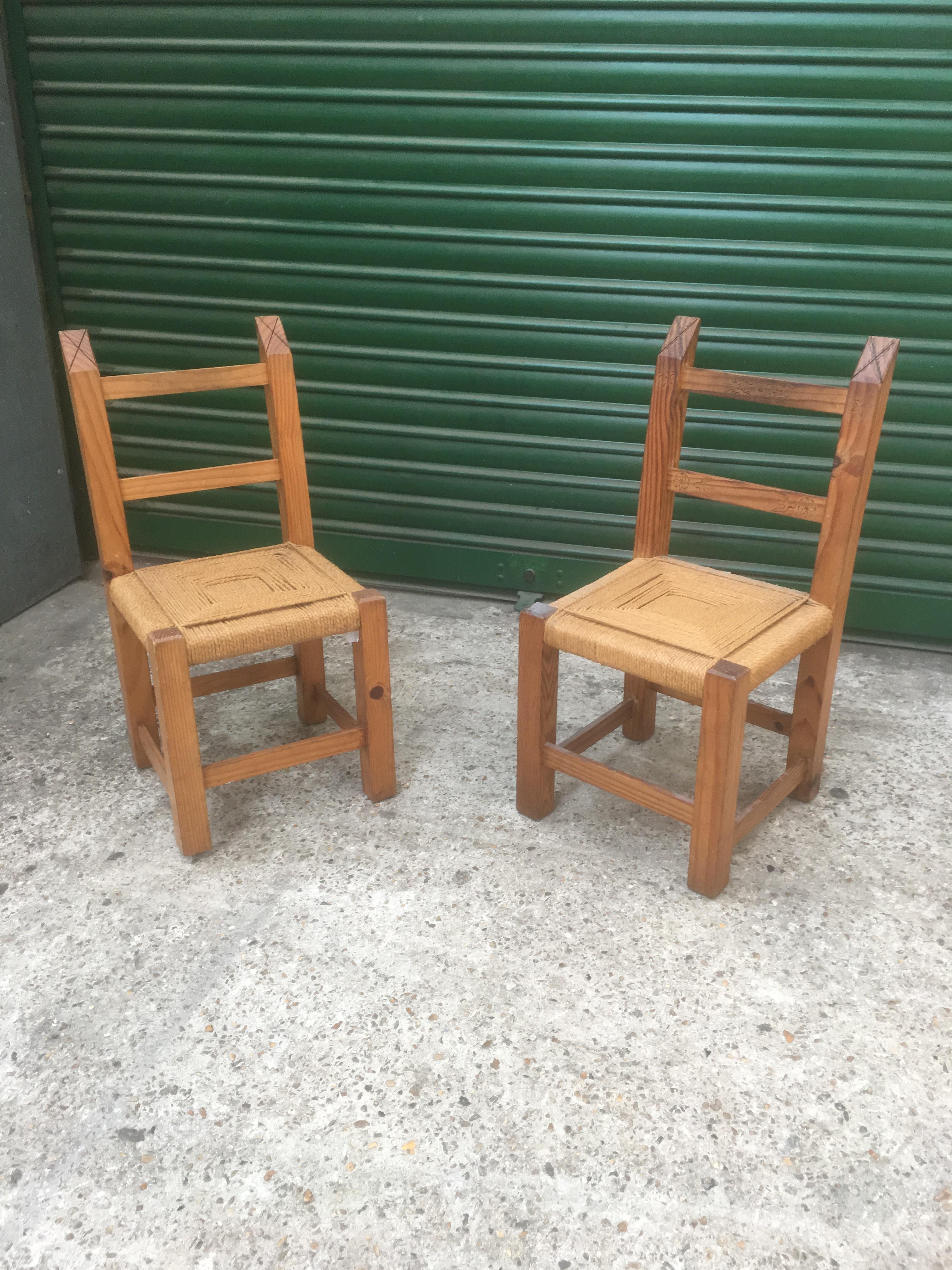 A pair of chairs in rope and oak, circa 1950.