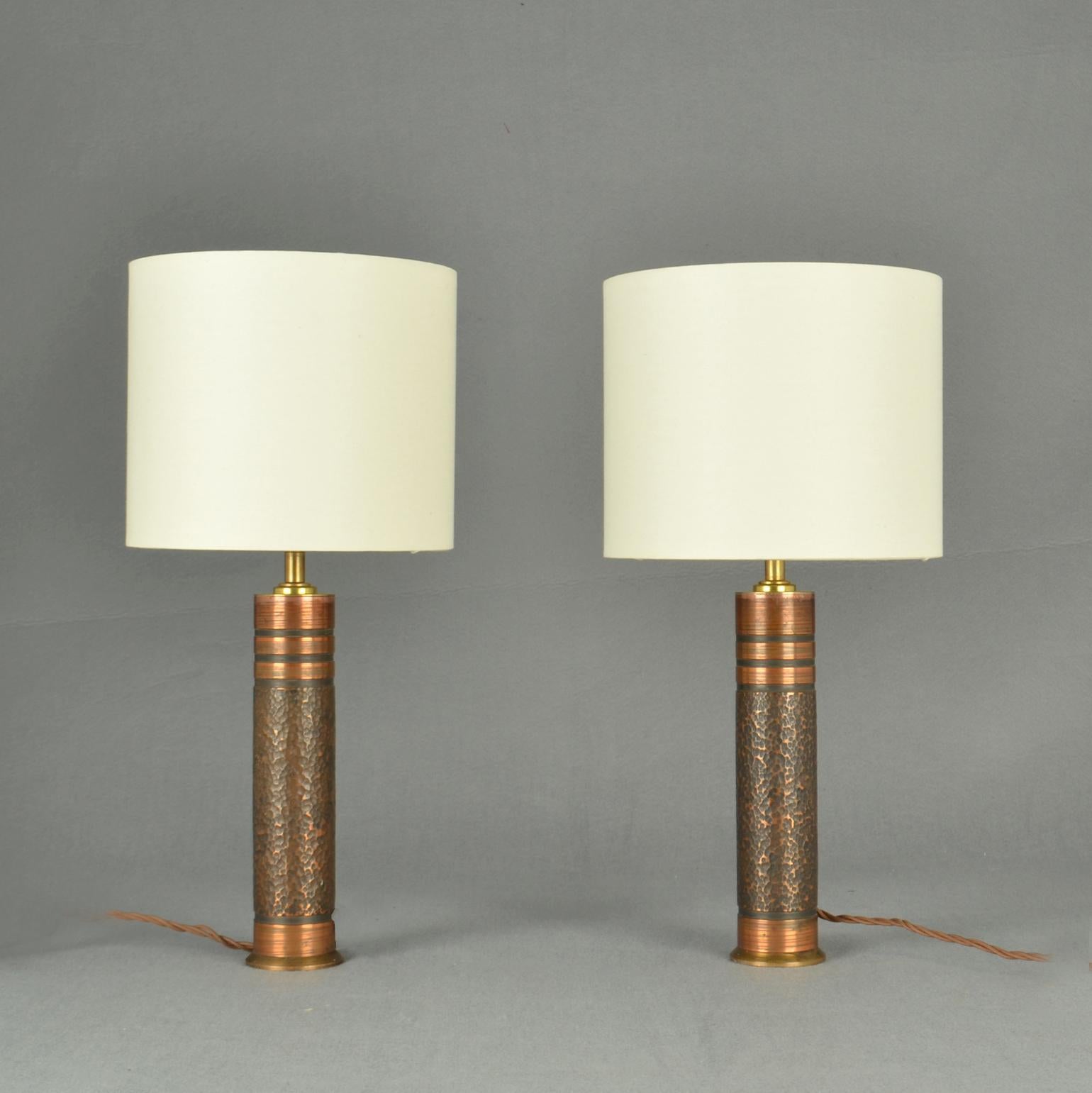 Pair of Brutalist copper cylinder table Lamps with organic textured relief, 1970's Germany. 
Dimensions of the bases : Height: 32 cm, Diameter: 6 cm


  