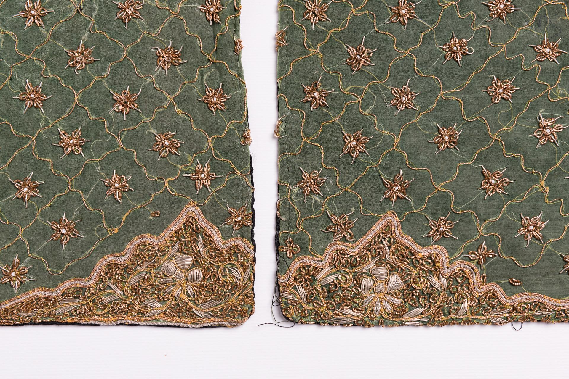 Pair of small pillows recovered from an old Indian saree embroideree in gold wire.  I have madesome cushion covers using the undamaged parts of high quality antique 