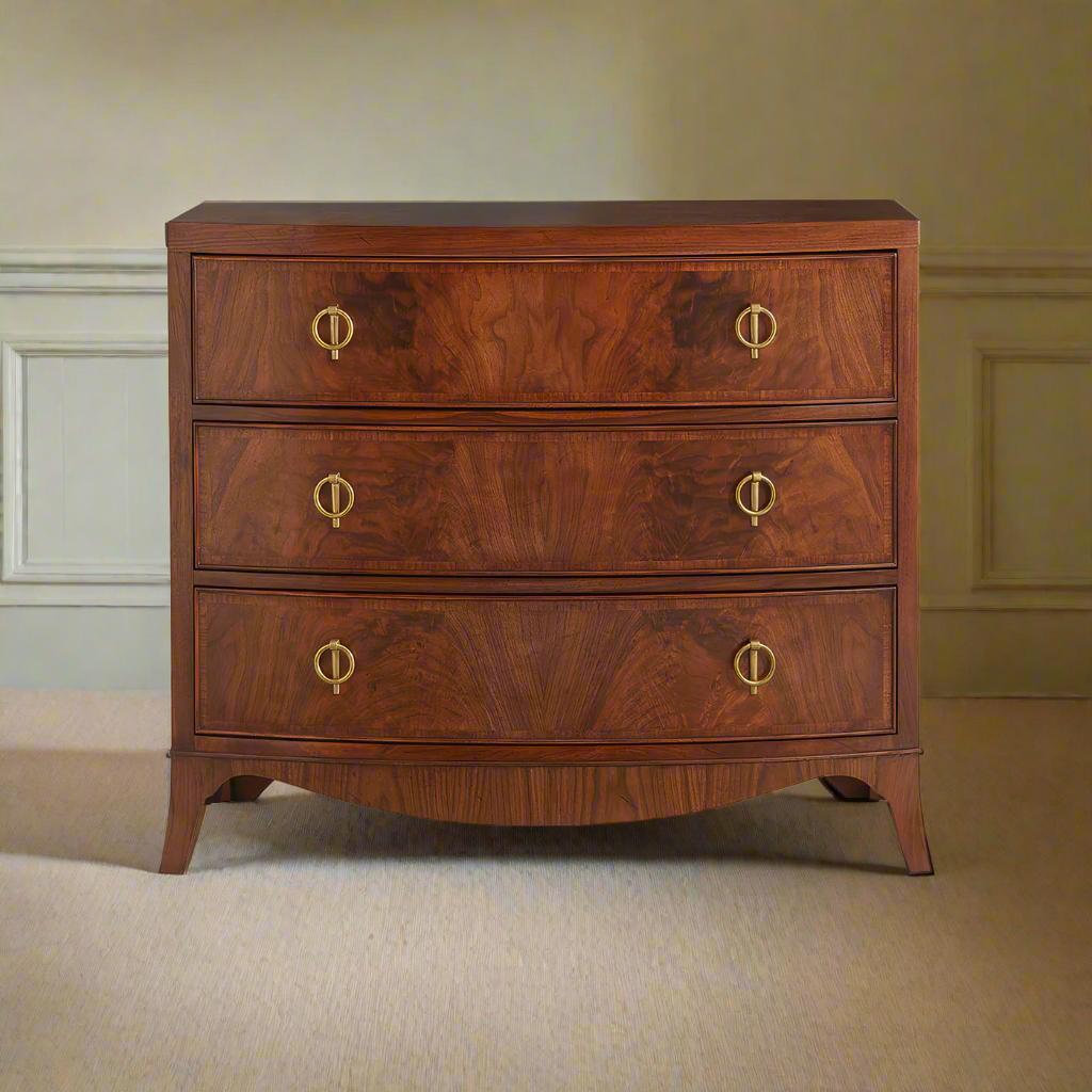 Constructed from mid-tone walnut-figured veneer, these exquisite chests showcase rich grain patterns that enhance its sophisticated appeal. The three cockbeaded soft-close drawers offer ample storage, while the brass hardware adds a refined touch,