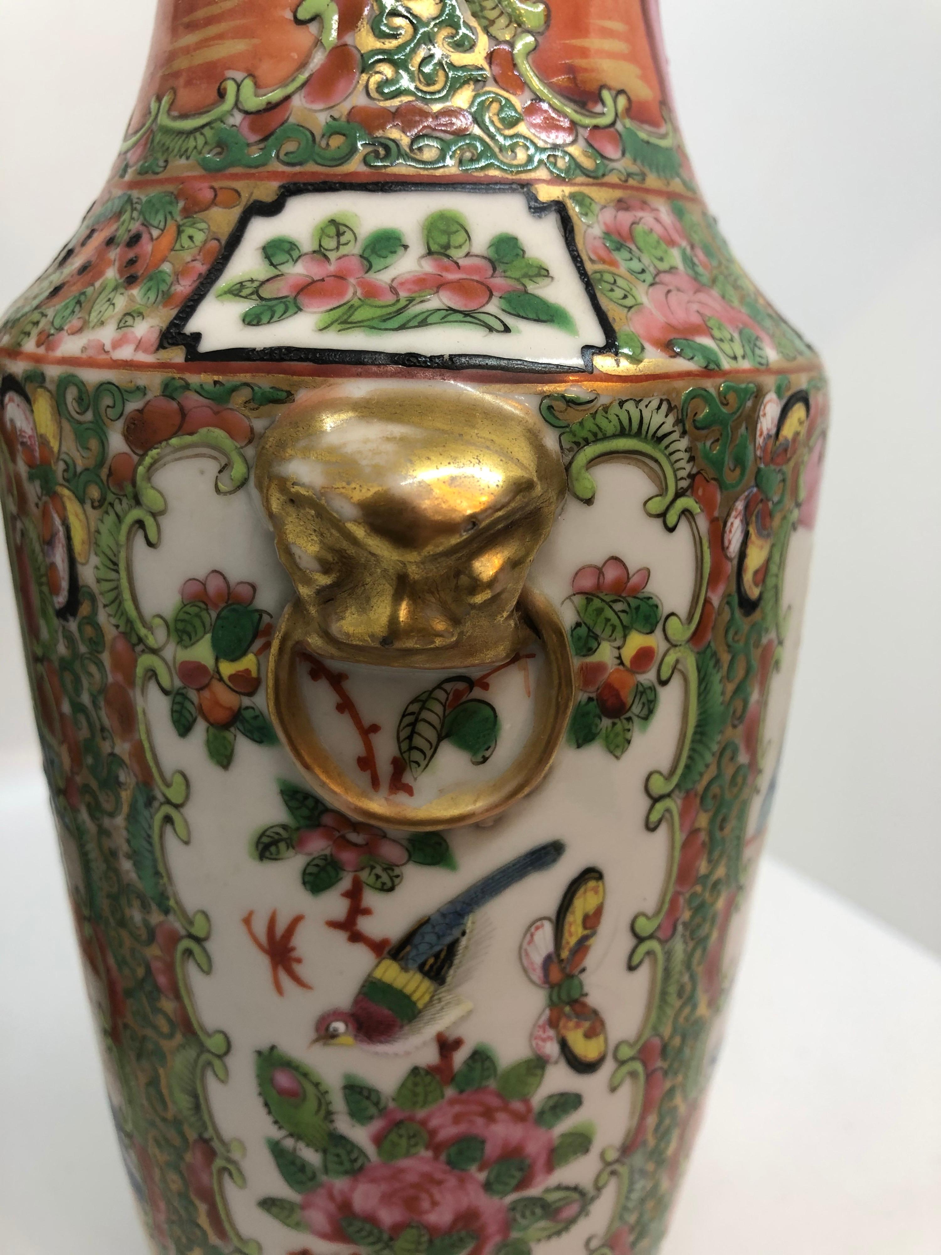 Small pair of famille rose vases with gilt lion head handles