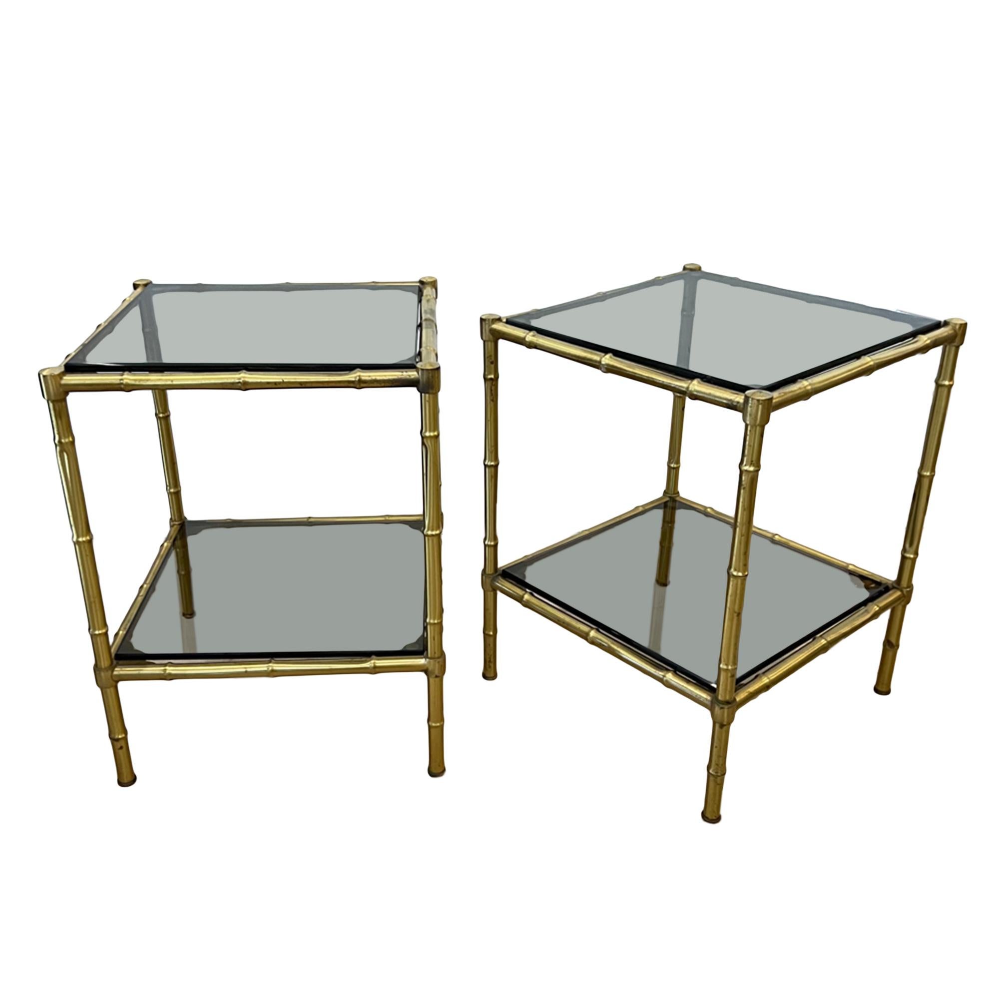 These lovely neat pair of brass faux bamboo side tables were made in France in the 1970s. With the original smoked glass - a classic design of the midcentury period. 

Perfect for a smaller reception room or study.