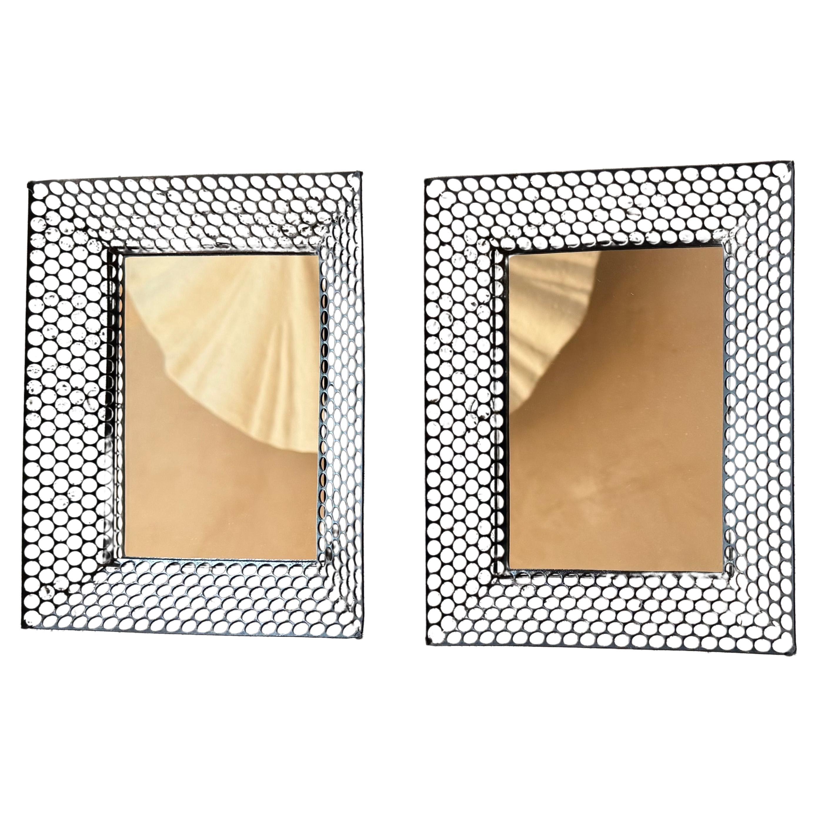 Pair of small French 1950’s pierced metal framed mirrors
