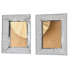 Pair of small French 1950’s pierced metal framed mirrors