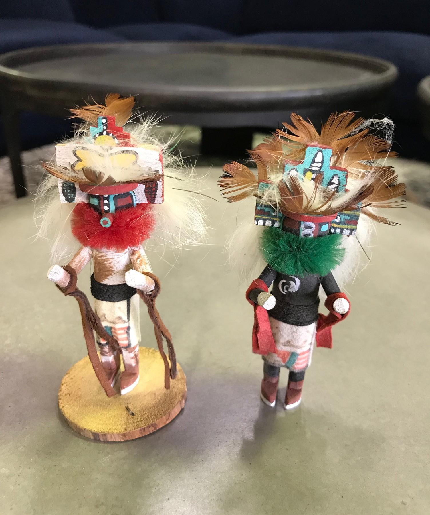 A wonderfully detailed and decorated pair of miniature Kachina dolls.

Signed by the artist on the base of one doll.

From a collection of Native American objects and artifacts.

Dimensions: 4.25
