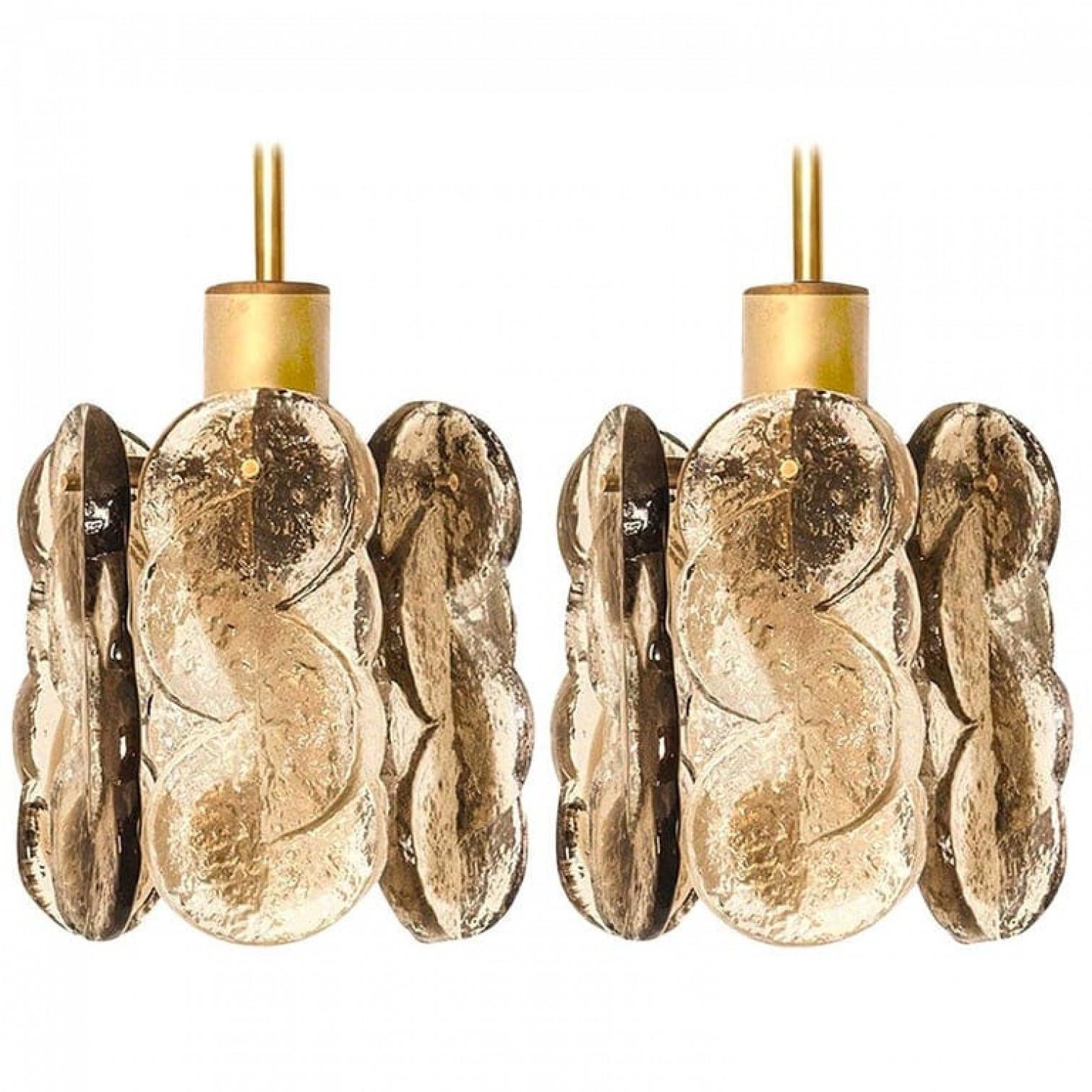 A pair of gorgeous Murano glass pendant lights by Kalmar, 1960s. High quality smoked swirl ice glass, 6 clear twisted crystal glass panels with a light gold dish amber colored stripe in it.

Heavy quality. Cleaned and well-wired, in full working