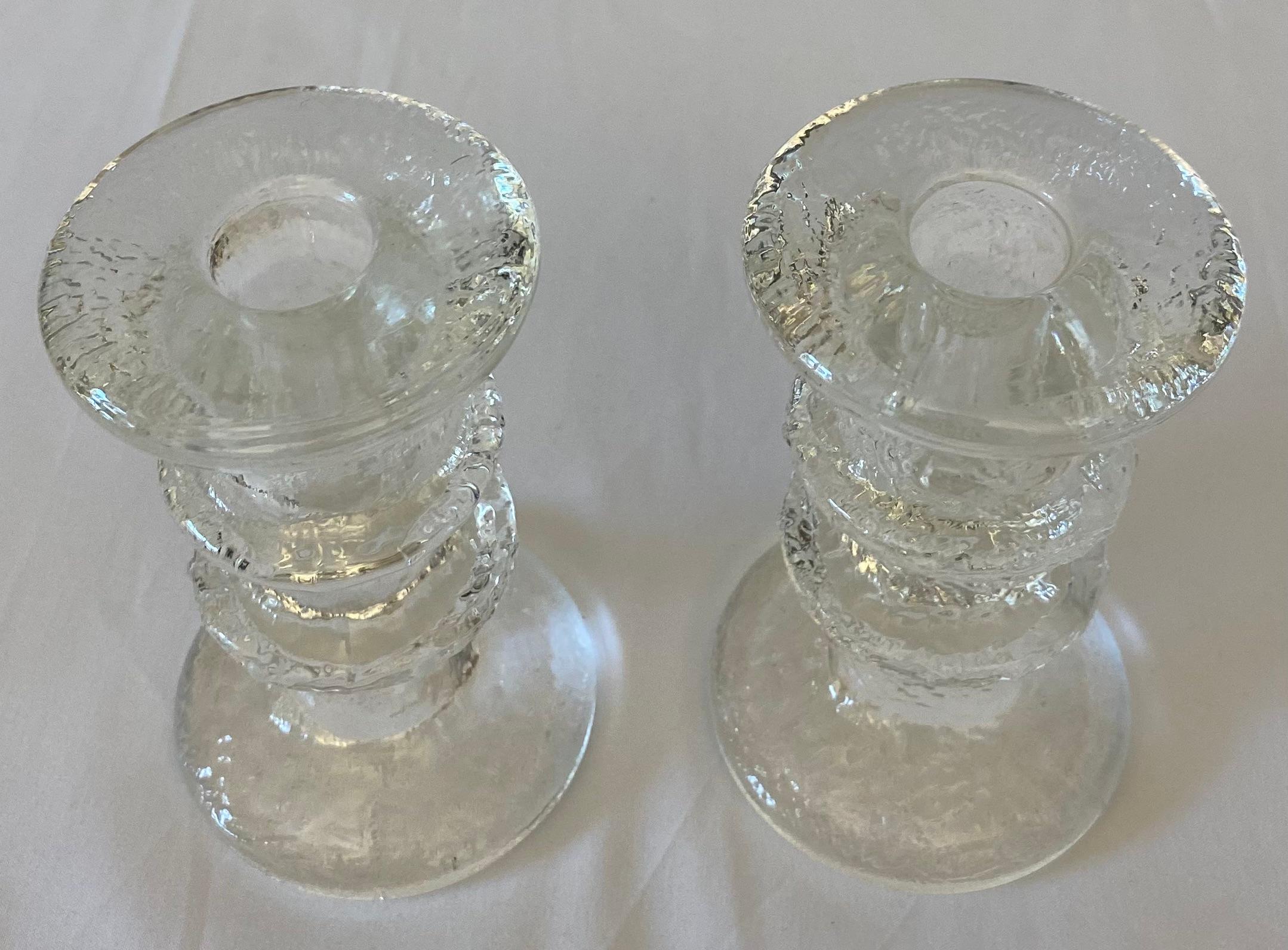 A fine quality pair of modern glass candle holders in the style of Kosta Boda pieces made that are Sweden, but may be the work of Littala Crystal from Finland. Perfect vintage condition, no chips or cracks. 

Measures: 3'