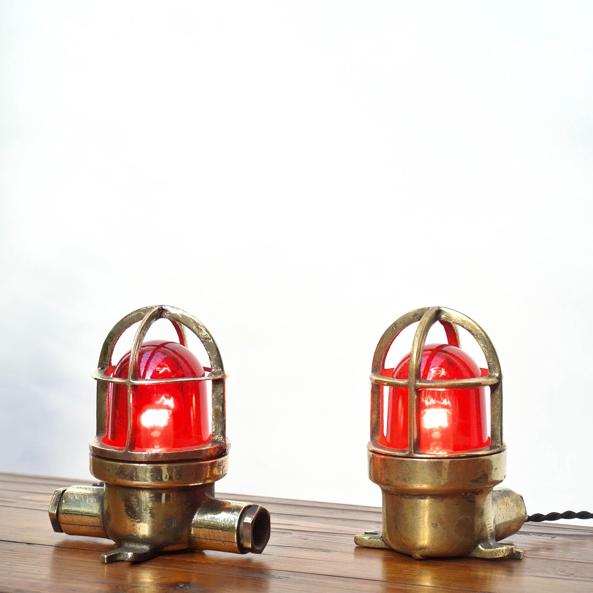 Pair of vintage small signal lamp in brass with red glass. Perfect for a bright decoration!

 