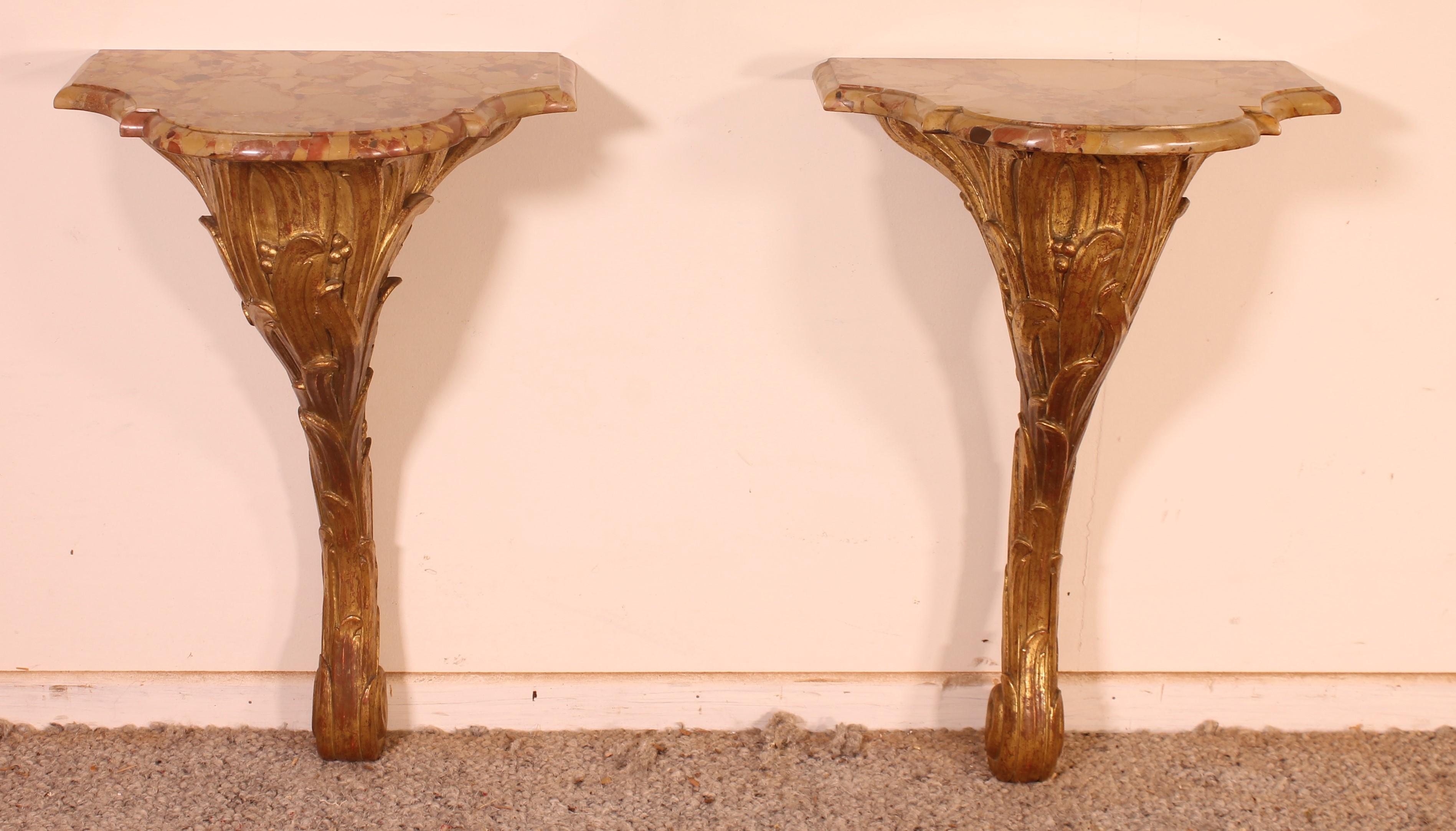 Very nice pair of small Louis XV style consoles from the end of the 19th century in gilded wood
Lovely pair in carved wood topped with a breccia marble which has very beautiful curves and a corbin beak.
The consoles can be used as consoles or as a