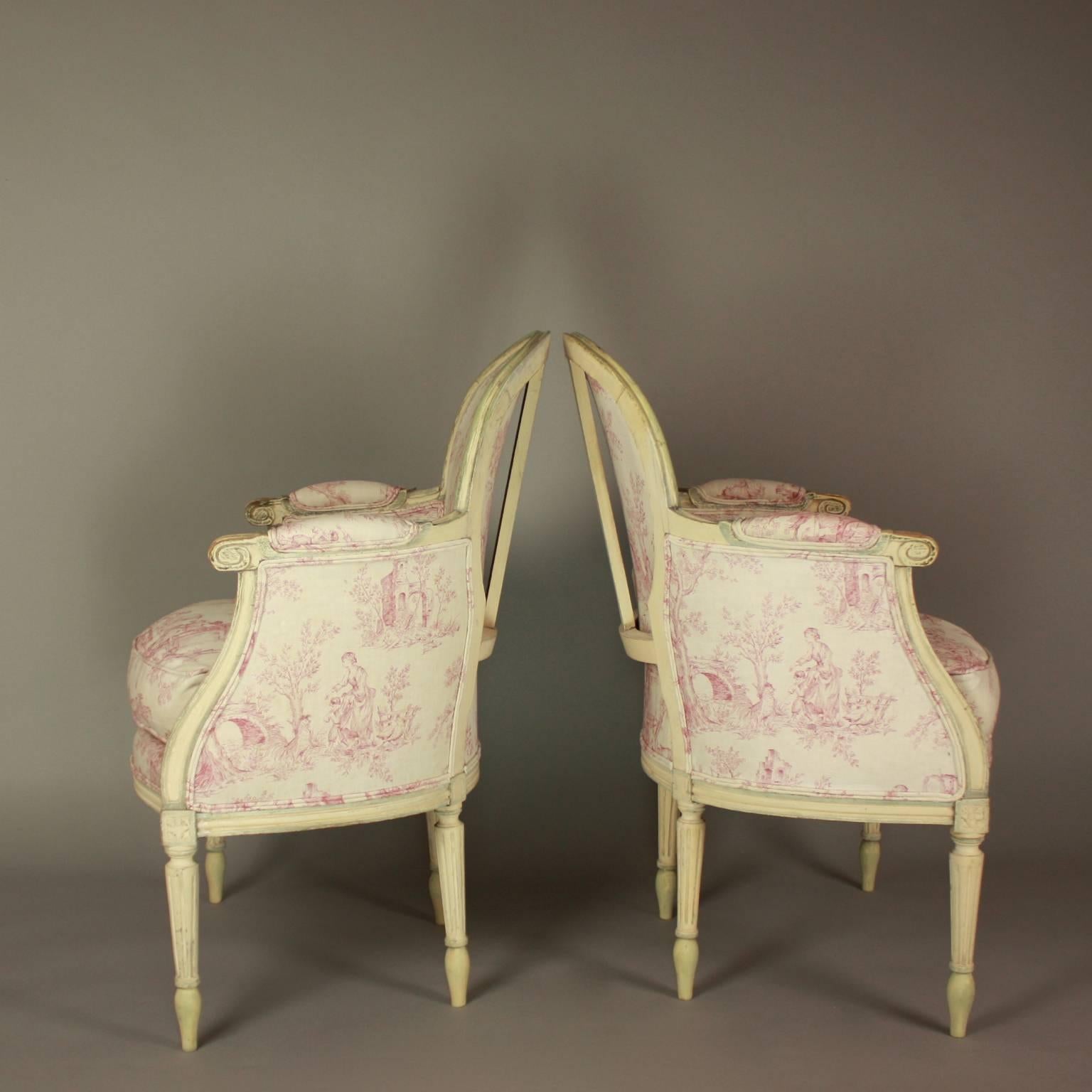 Carved Pair of French 19th Century Louis XVI Style Painted Wood Armchairs or Bèrgères
