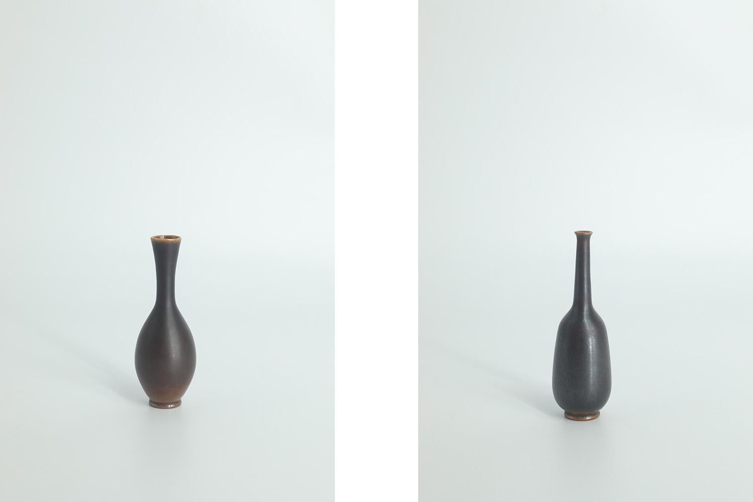 
1. Height 8.5 cm  Width 2.5 cm  Depth 2.5 cm
2. Height 8 cm  Width 2.5 cm  Depth 2.5 cm

This set of 2 miniature vases was designed by John Andersson for the Swedish manufacture Höganäs Keramik during the 1950s. Handmade by the Master, with the