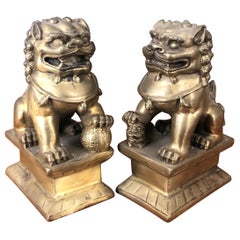 Pair of Small Patinated Bronze Chinese Foo Dogs