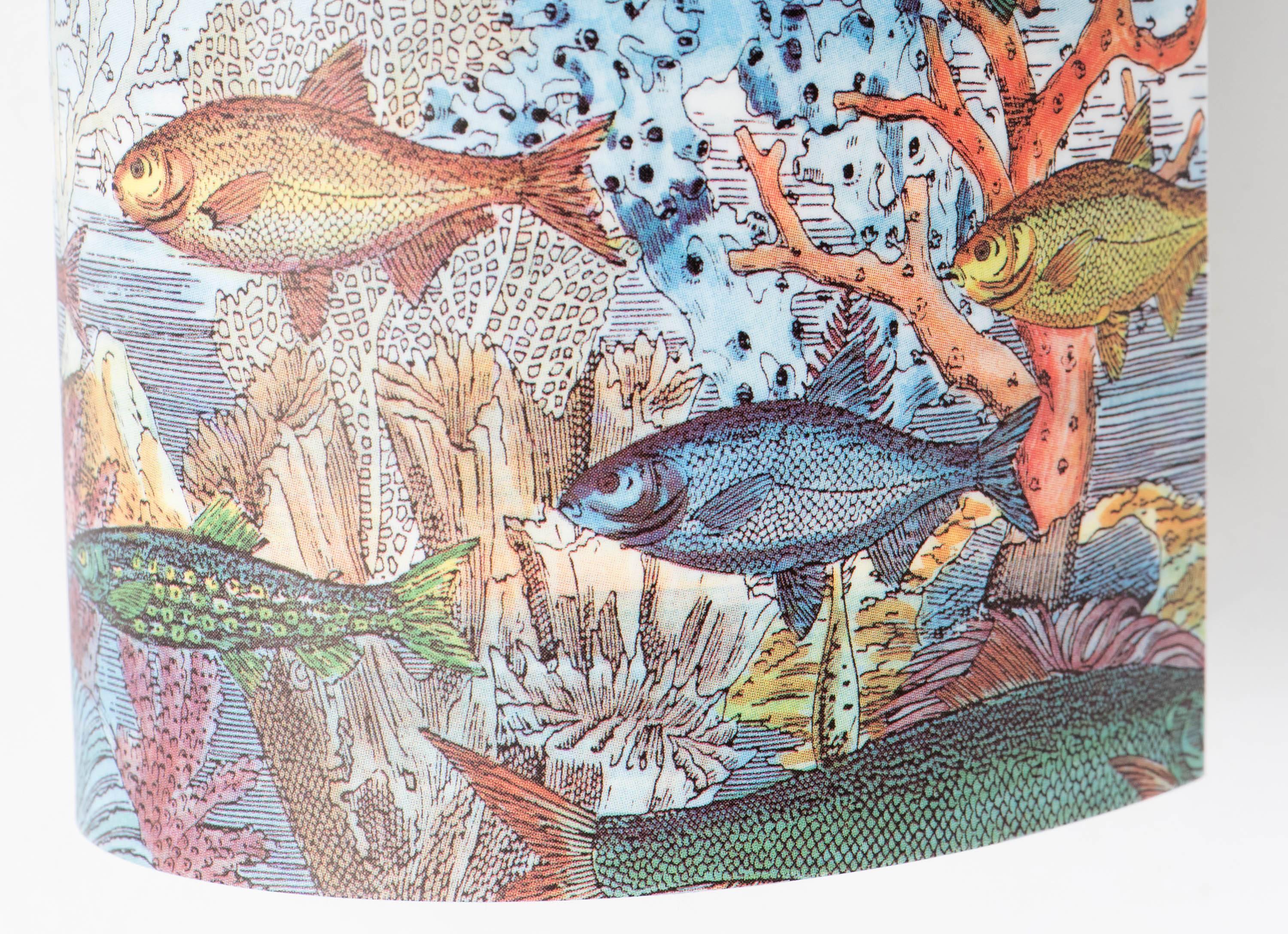 A pair of lamps by Barnaba Fornasetti. 
“Aquario medio” 
Printed and colored Perspex. 
Made by Fornasetti and Antonangeli, Paderno Dugano, 
Italy, circa 1995. 
Measures: 33 cm high x 12 cm wide x 16 cm deep.