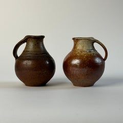 Pair of small pitcher by Jacky Coville