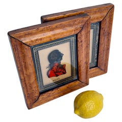 Pair of Small Reverse Painted Glass Portraits of Nobility in Burl Wood Frames