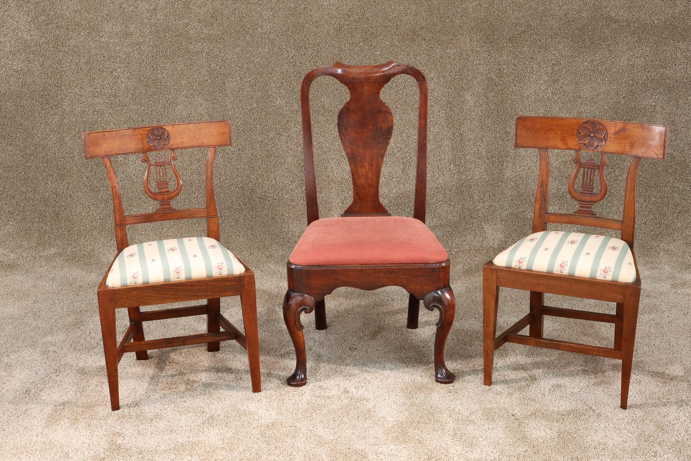 Pair of small antique French walnut side chairs with well carved crest rails and upholstered seats, circa 1850.