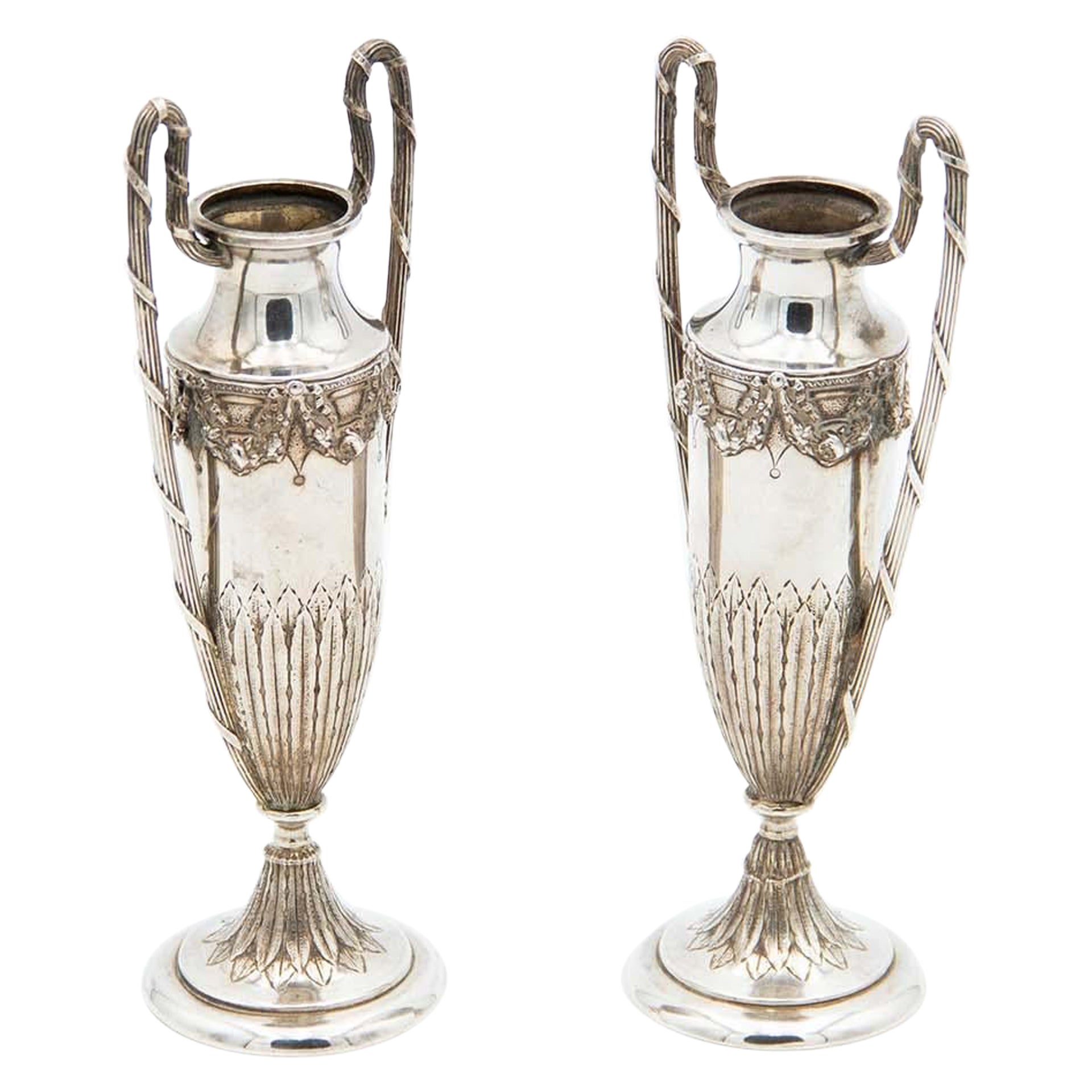 Pair of small silver flower vases with reliefs