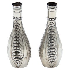 Pair of small silver vases with pearly reliefs