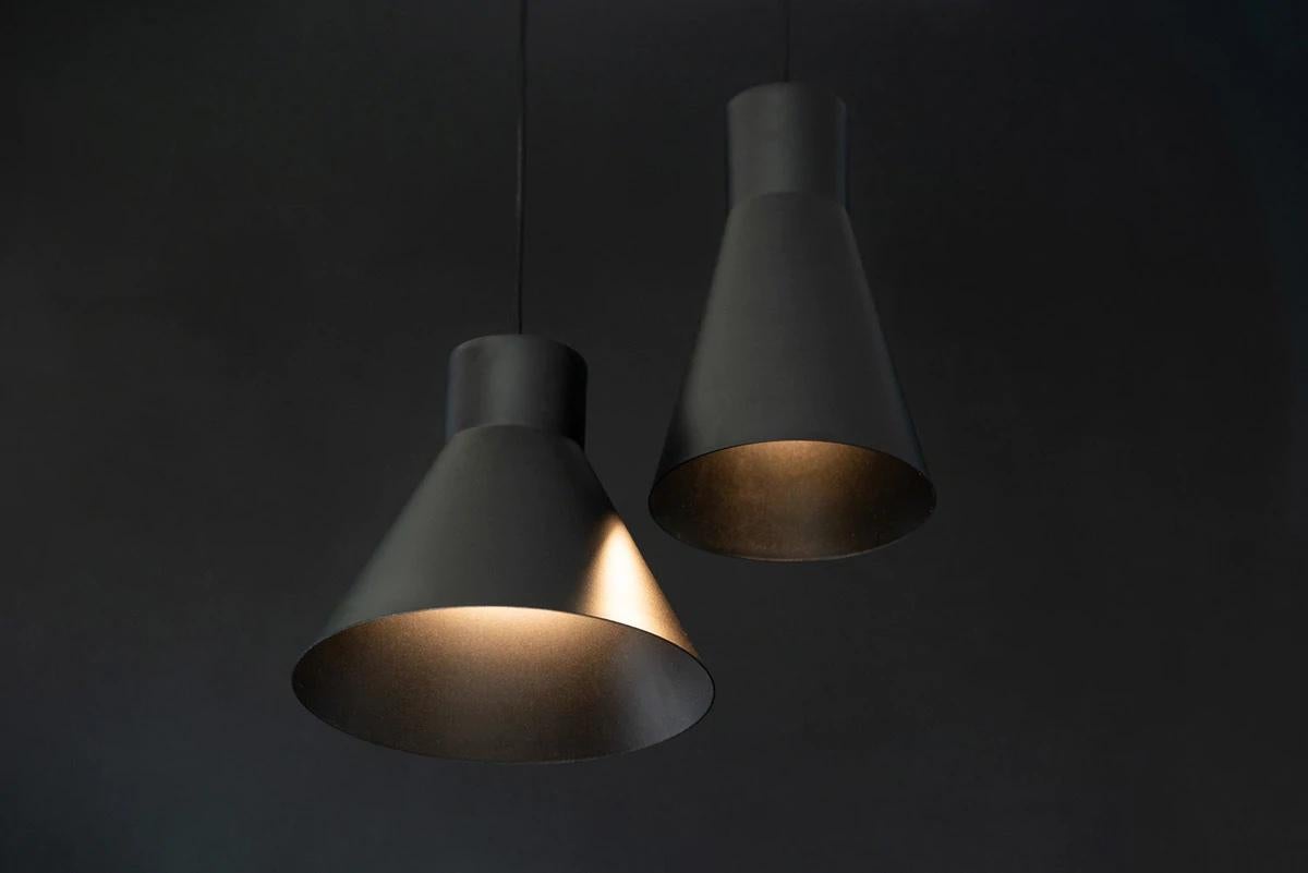 Pair of Small 'Smusso' Pendant Lamps by Matti Syrjälä for Innolux.

Executed in painted aluminum with matching textile cord. This cleanly designed pendant lamp is both functional and stylish; its geometric shape is contemporary yet timeless. Three