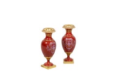 Pair of small vases in red porcelain and gilt bronze, circa 1900