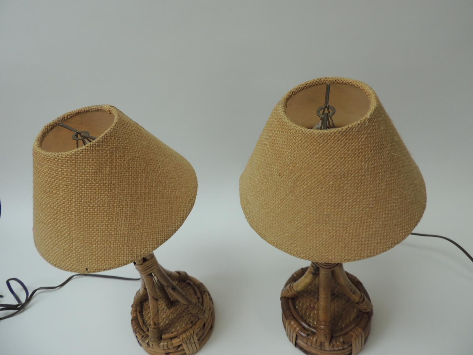 Pair of small vintage bamboo and rattan table lamps. Round base with original burlap clip-on shades.
Including the (2) light bulbs. Brass fittings and brown plug in cord.
Size: 5.5 base x 15.5 height
Shades: 7.5 bt x 4 H x 3Tp.