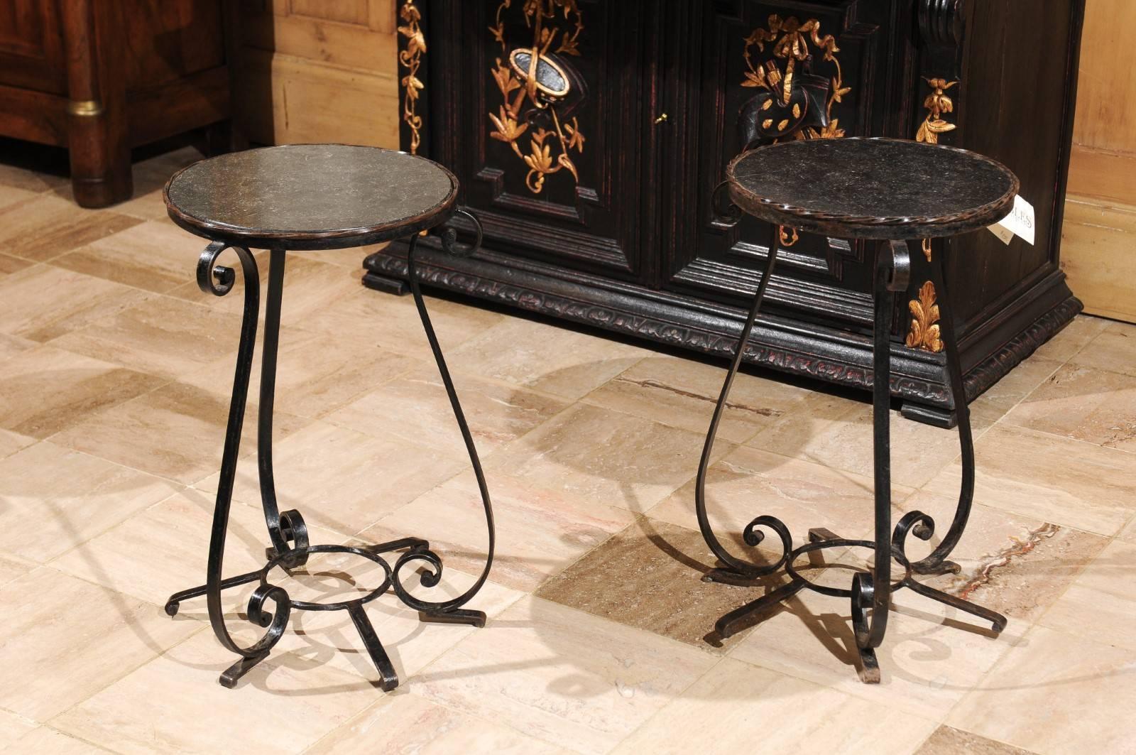 Pair of small vintage wrought iron tables with iron tops from France

This is a nice little pair of tables to use on a porch or in any other room to add a contrast in materials. They are a good size to keep by a chair but they would also work well