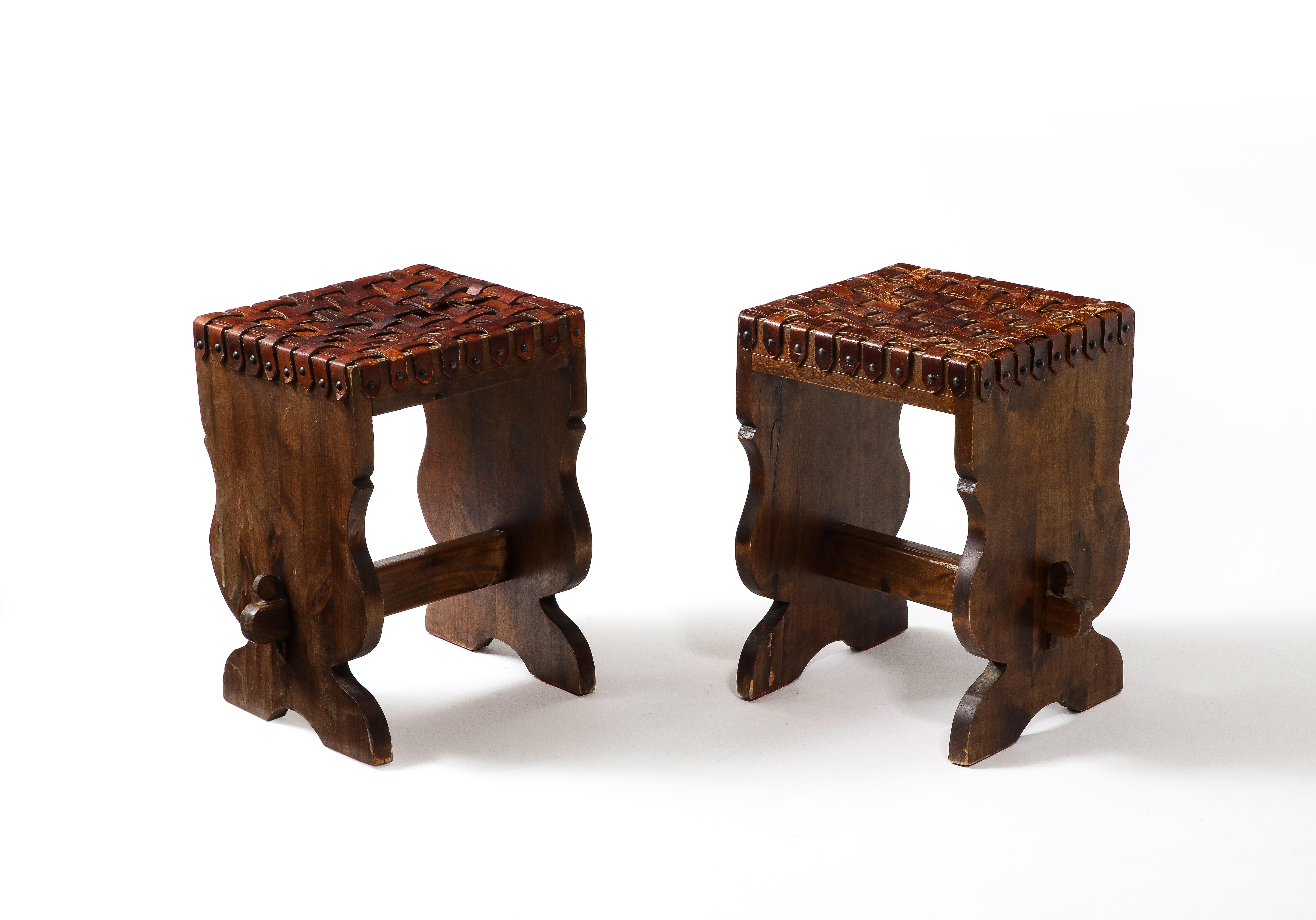 Woven leather and elm stools with nailheads.
