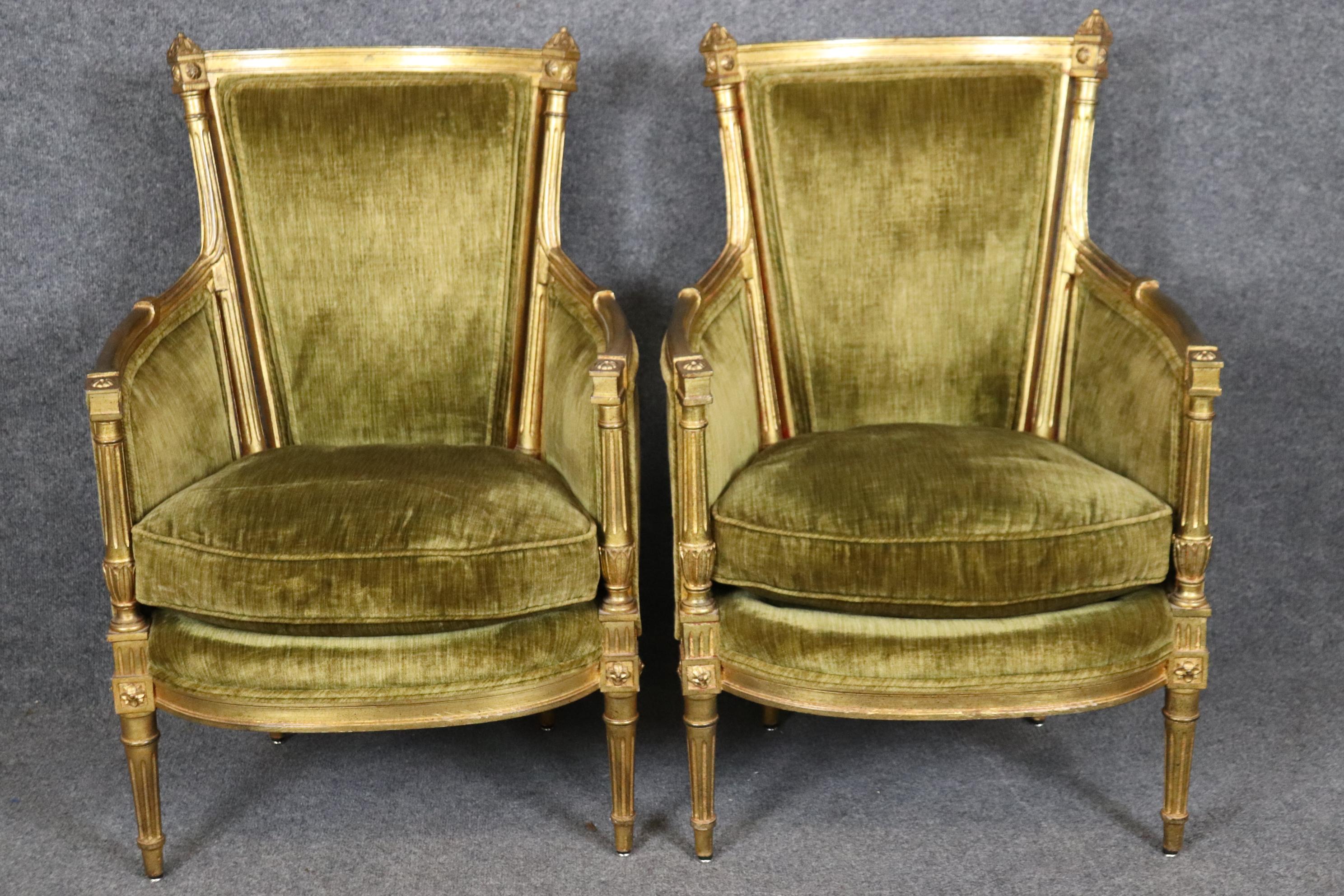 This is a beautiful pair of French-made gilded smaller scale bergere chairs. They have been reupholstered in Brooklyn NY and appear to be in good condition with regards to their upholstery and the frames are beautiful and luminous. Goose down