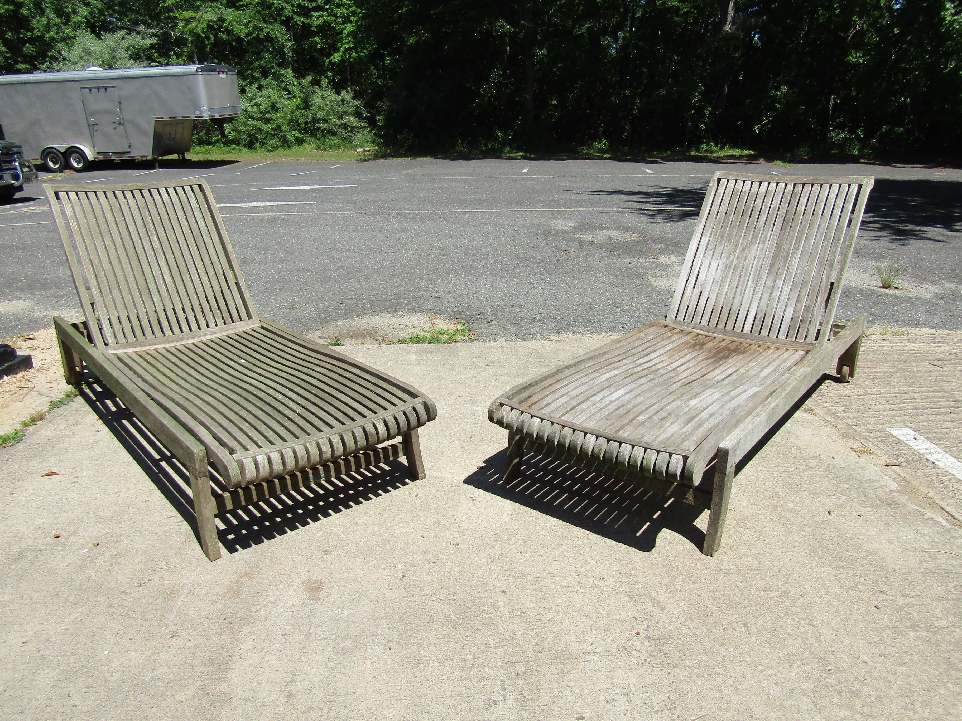 Unique pair of Smith & Hawken lounge chairs in an all wood design. These chairs feature 2 wheels for easy transportation and have sleek mid century look. Make them yours today. Please confirm item location (NY or NJ).