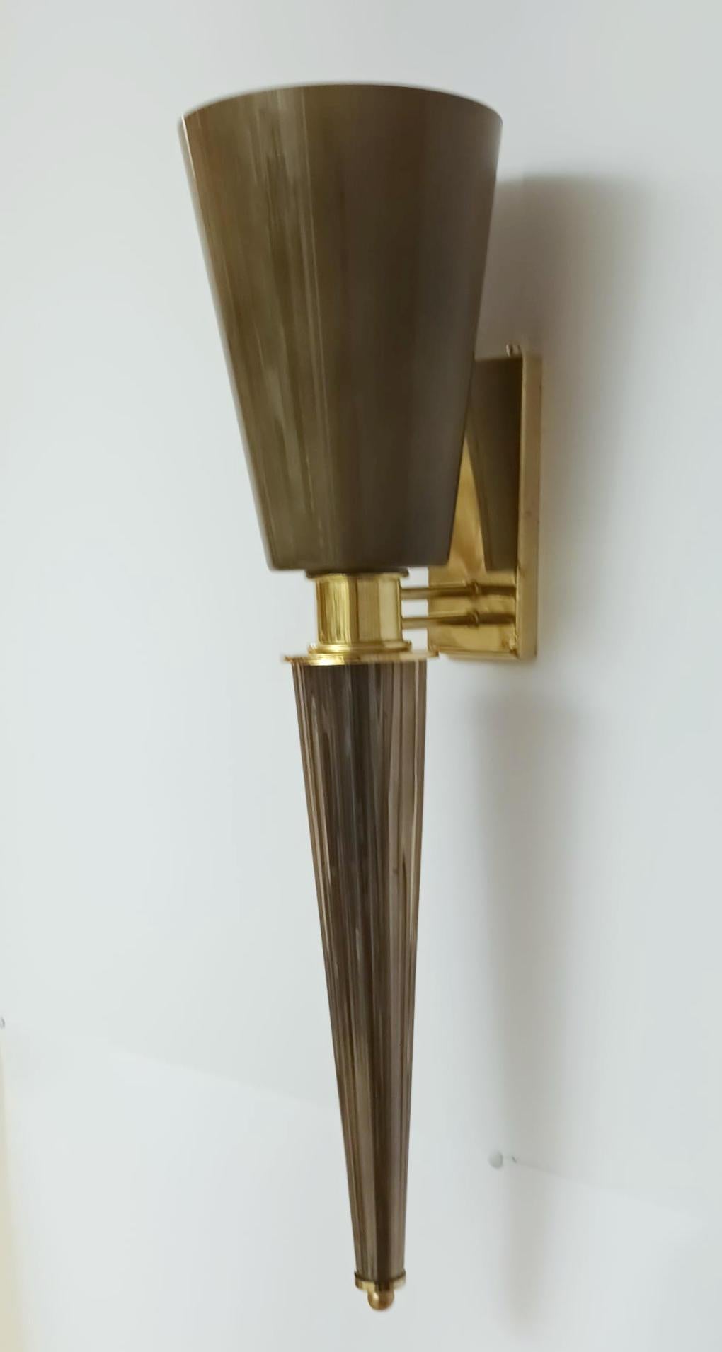 Italian torchere wall sconces with hand blown smoky gray Murano glass cone shades mounted on brass frames / Made in Italy
1 light / E26 or E27 type / max 60W
Measures: height 29.5 inches, width 8 inches, depth 10 inches
2 pairs in stock in Italy,