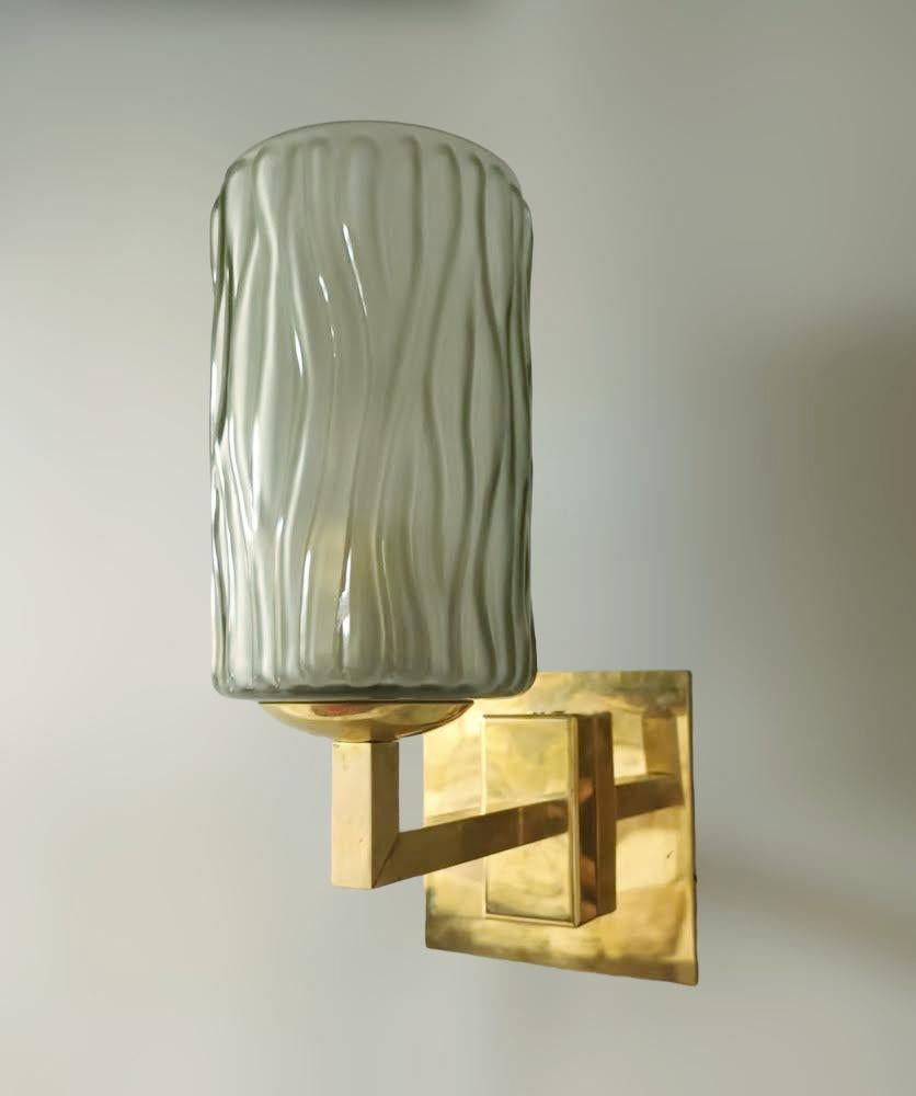 Italian wall lights with smoky textured Murano glass shades mounted on brass frames / Made in Italy by Barovier e Toso, circa 1950s
Original mark on the backplate
Measures: height 10.5 inches, width 5 inches, depth 7 inches
1 Light / E26 or E27 type