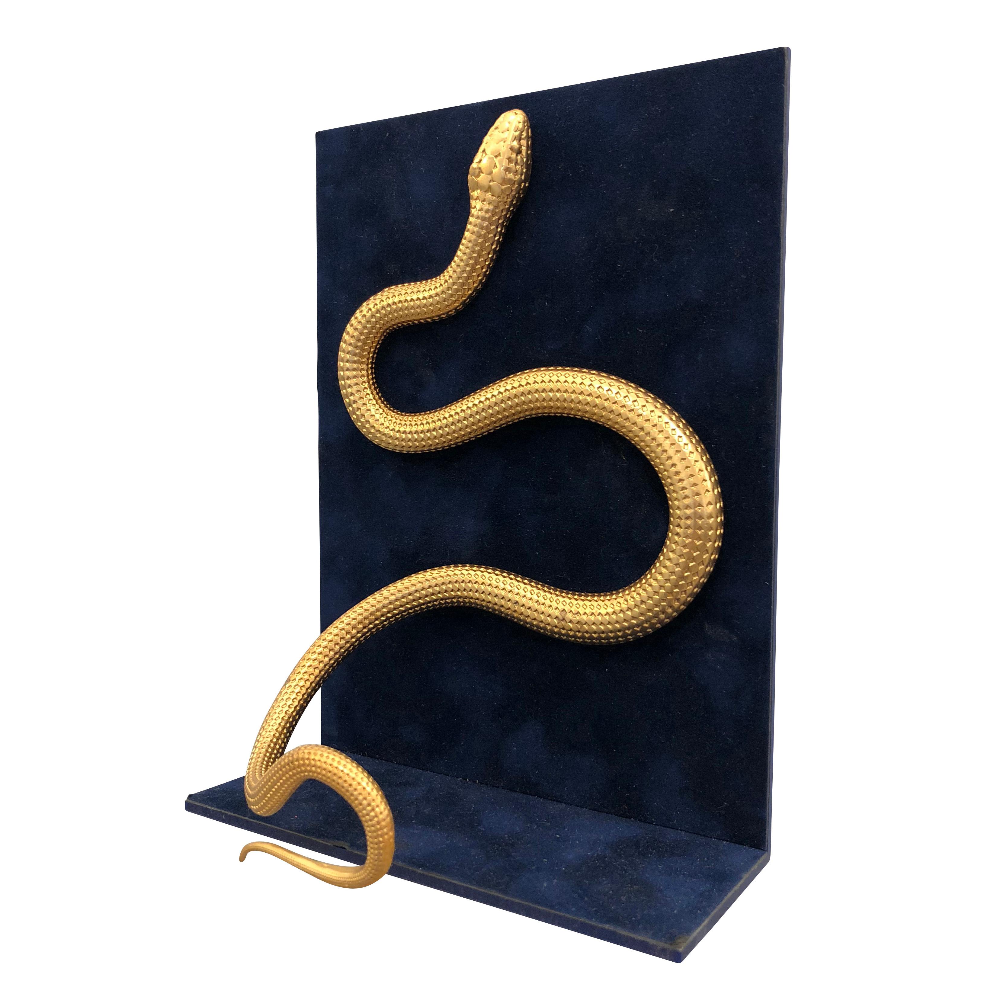 Pair of book ends with brass snakes on a blue velvet covered Lucite backing.

Condition: Excellent vintage condition, minor wear consistent with age and use

Width: 6”

Depth: 3”

Height: 8”

Ref#:OFZ26.