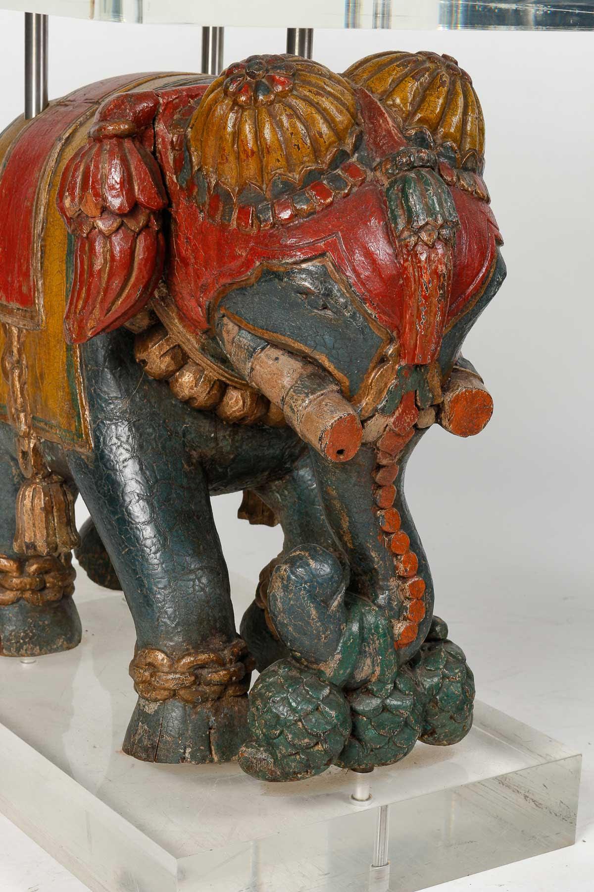 Pair of sofa ends, Elephant side table.

Pair of sofa ends, side table with elephants, elephants in painted wood with a base and a plexiglass top, slight scratches from use on the plexiglass, very good quality and workmanship.  

H: 55cm, W: 61cm,