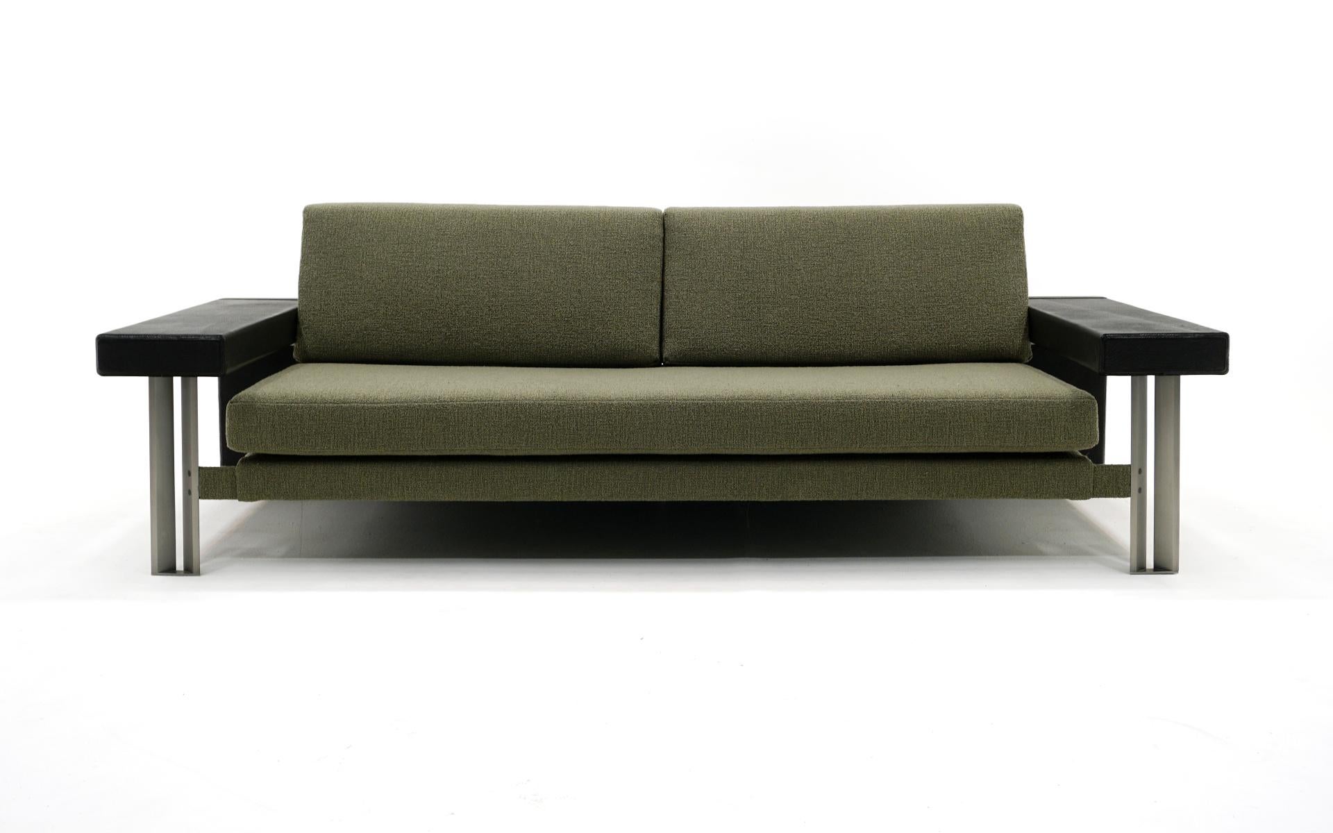 Two sofas designed by Giovanni Offredi for Saporiti, Italy, 1970s.  Newer muted green upholstery, Leather covered arms and back, lacquered wood backrest supported on a stainless steel frame.  Both sofas are in very good condition and ready to use.